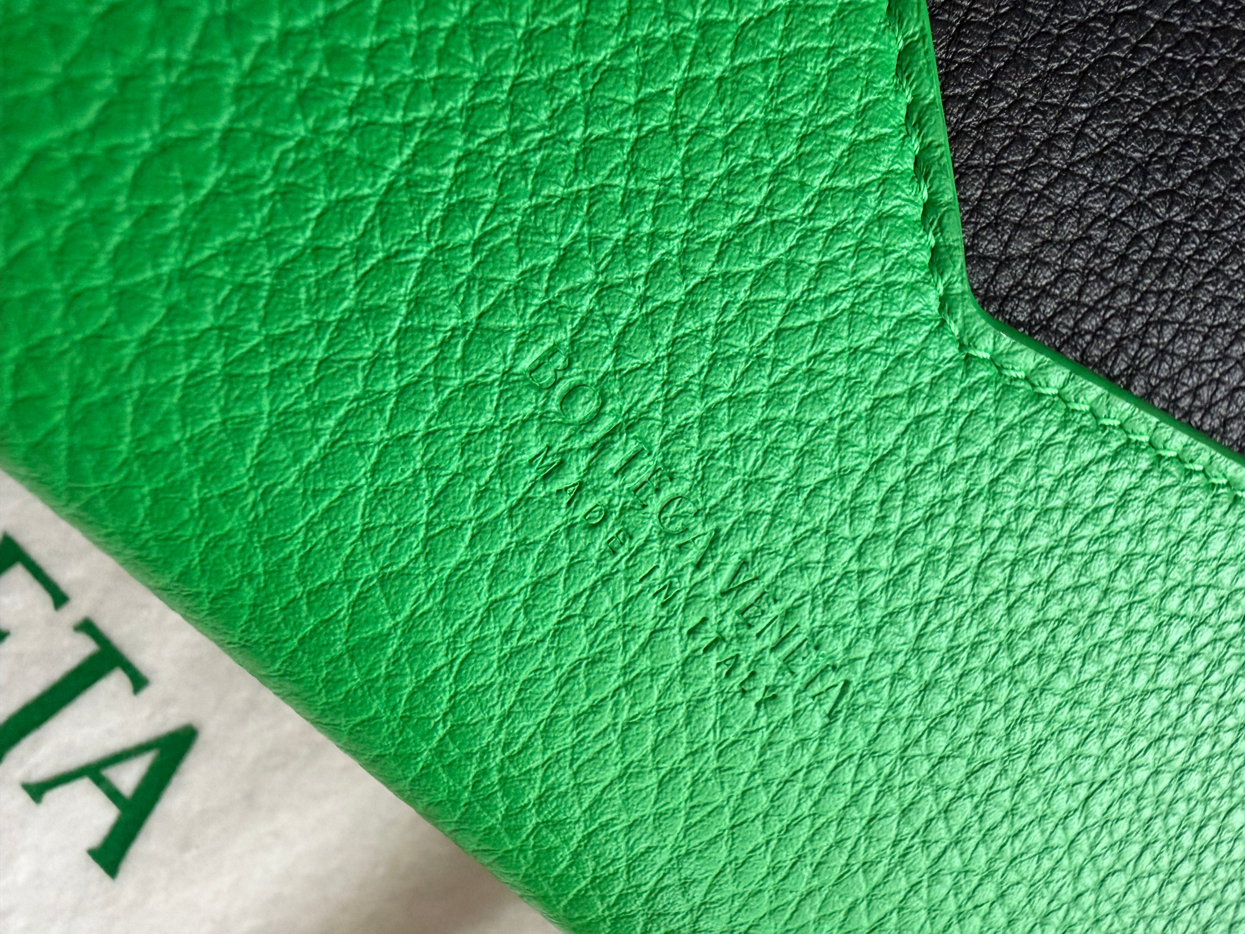 Bottega Veneta long envelope wallet in black and parakeet green logo