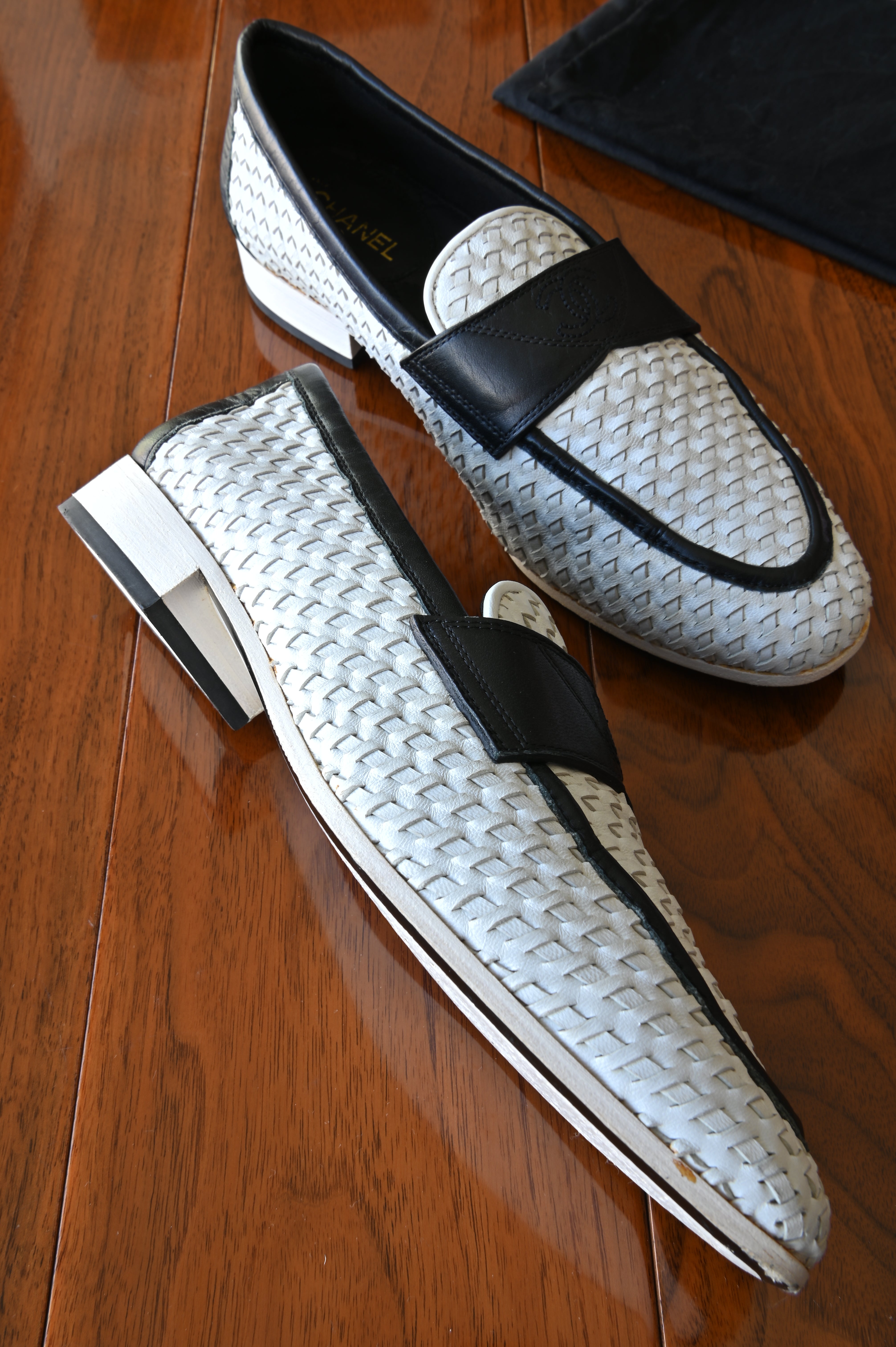 Chanel Black White Woven Leather Loafers left