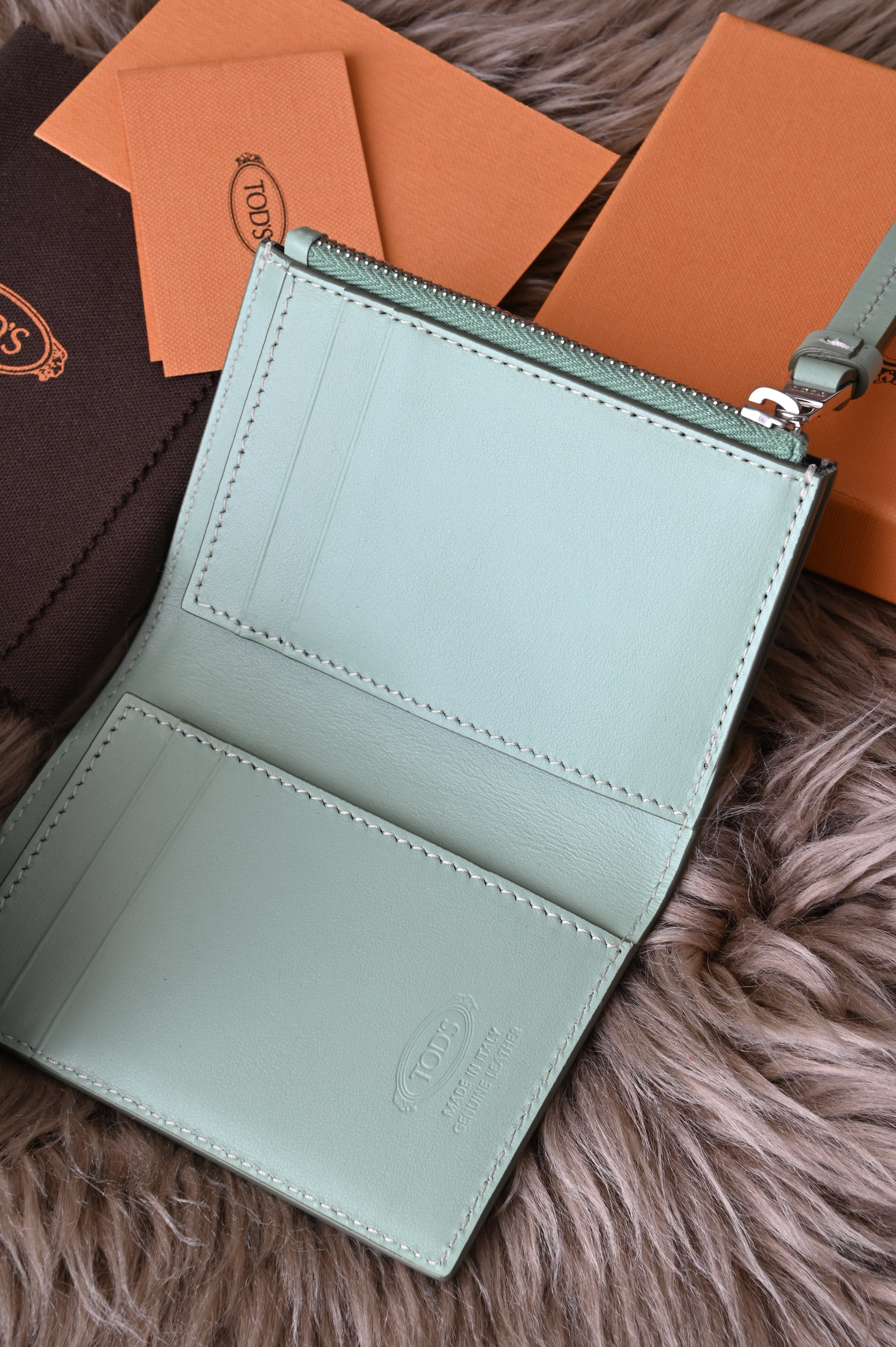 Tod's Flap compact wallet in teal green