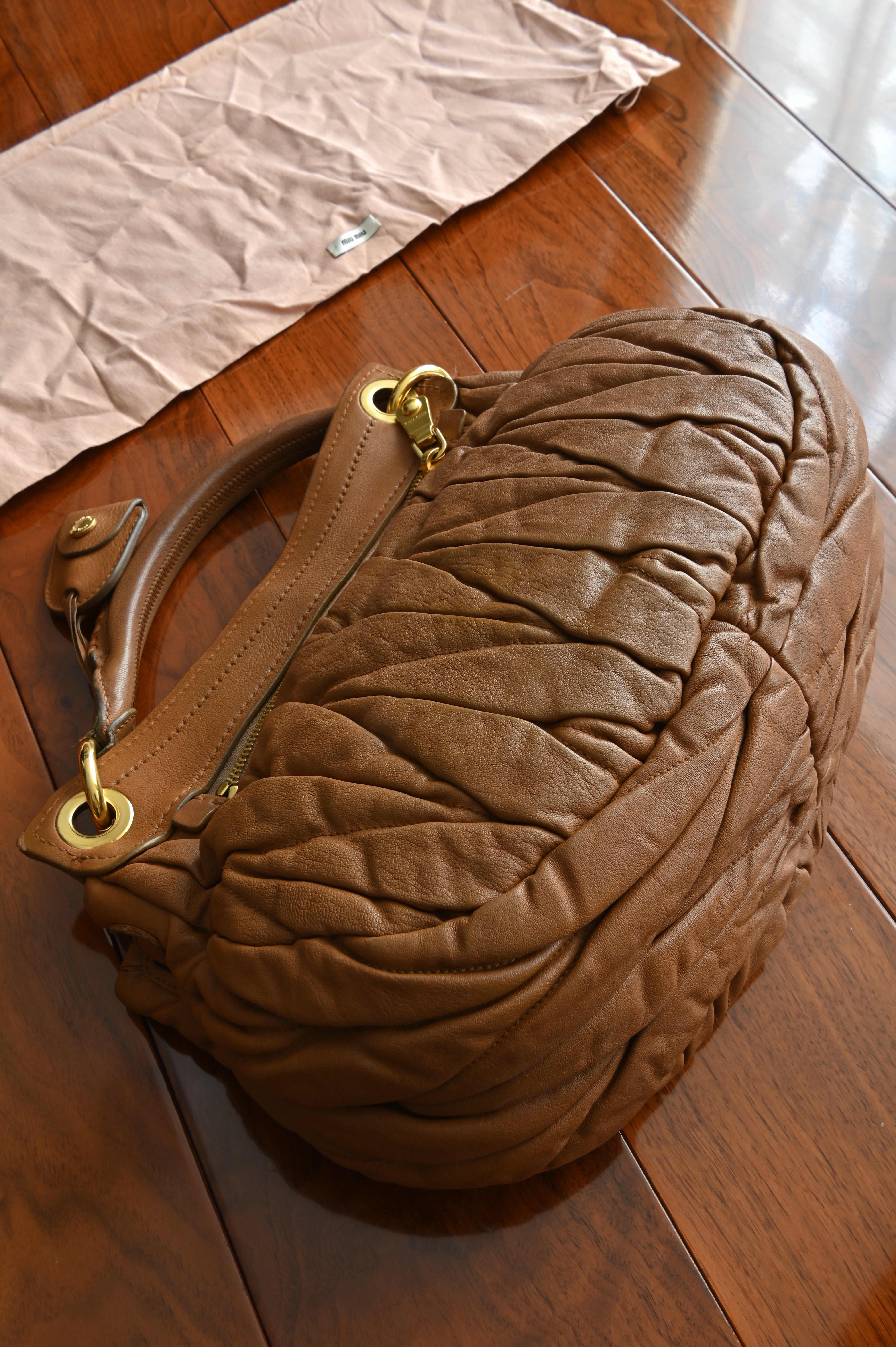 Miu Miu Coffer Matelassé leather hobo bag in Tan