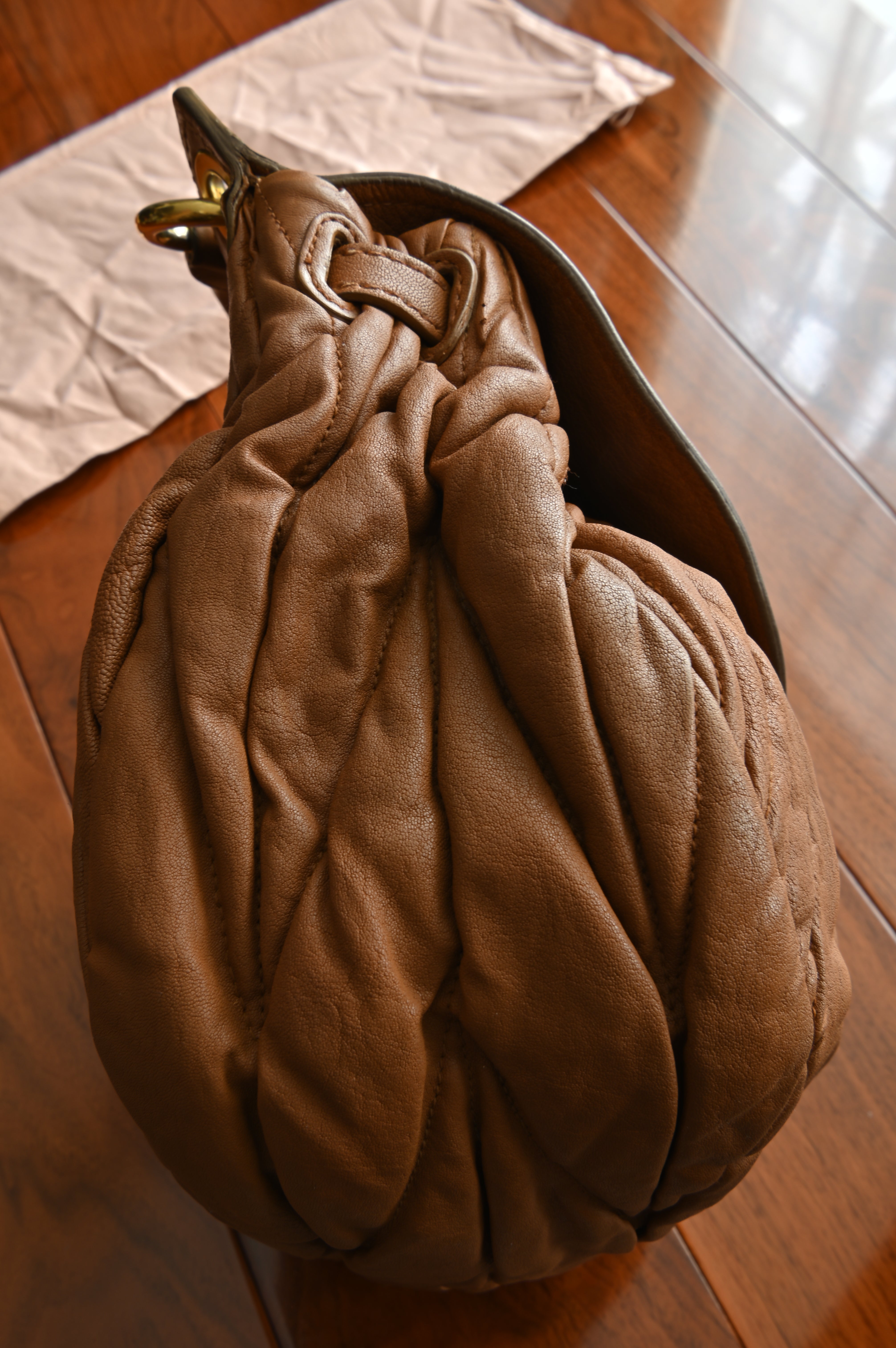 Miu Miu Coffer Matelassé leather hobo bag in Tan