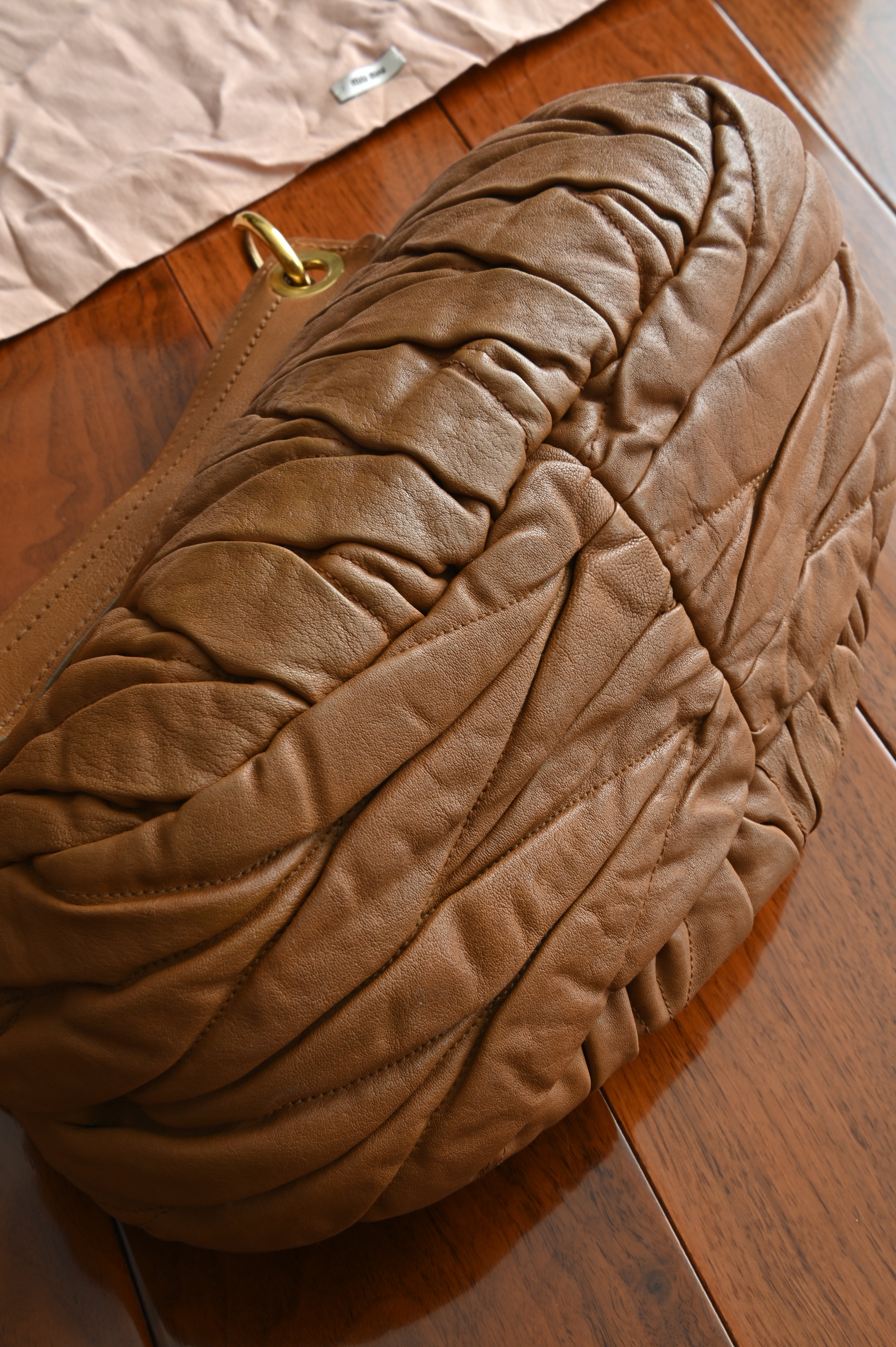 Miu Miu Coffer Matelassé leather hobo bag in Tan