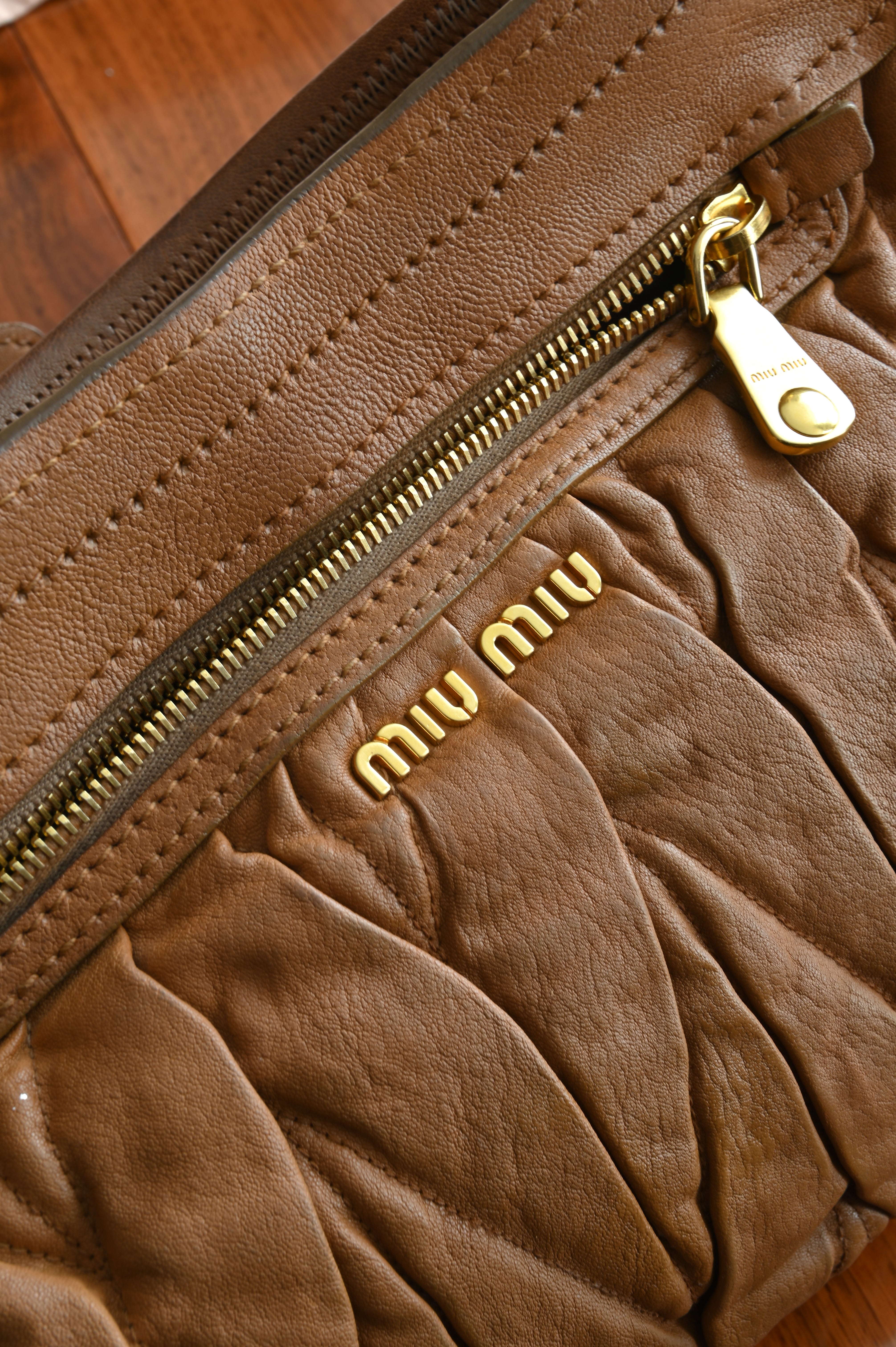 Miu Miu Coffer Matelassé leather hobo bag in Tan