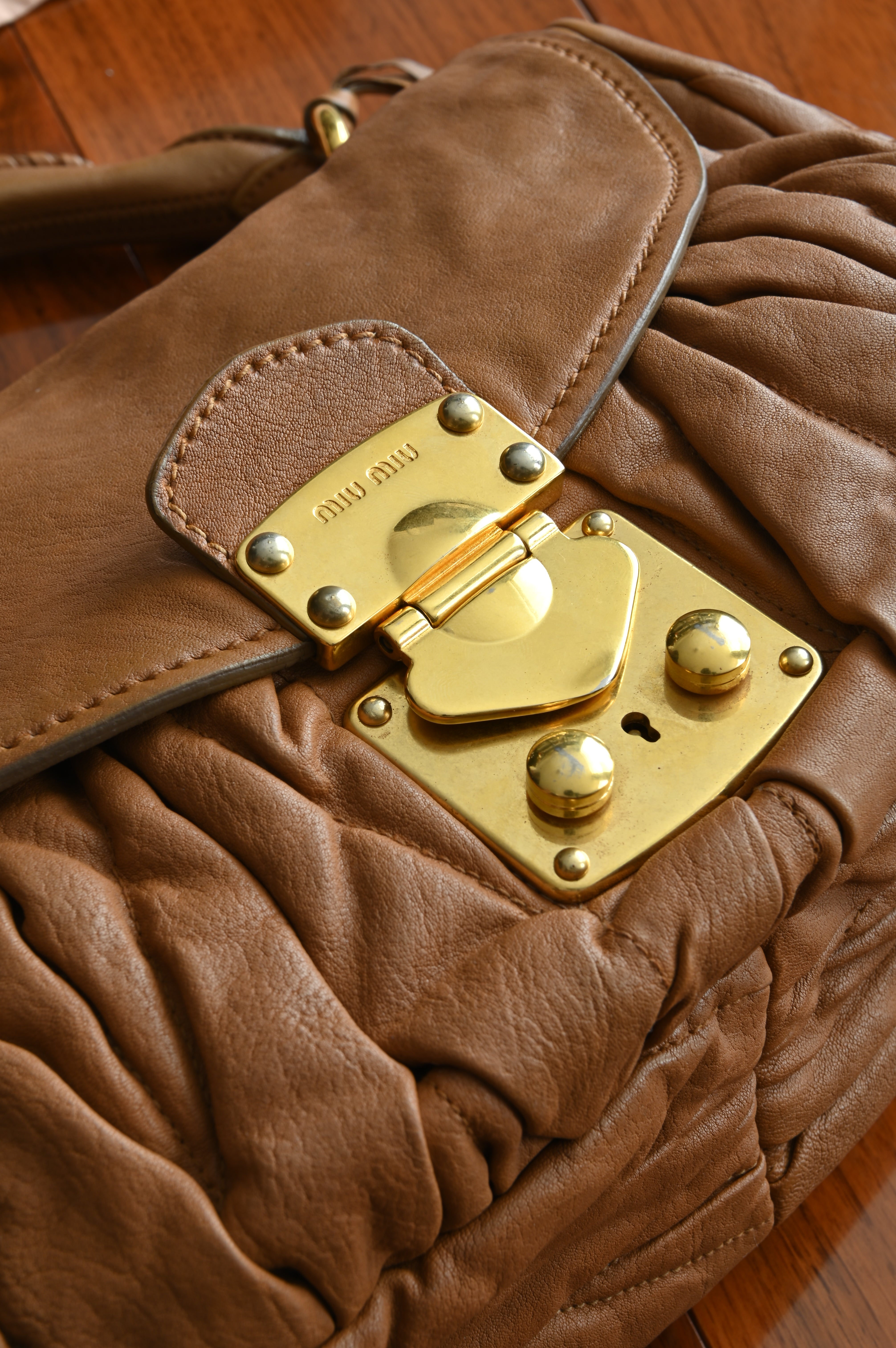 Miu Miu Coffer Matelassé leather hobo bag in Tan