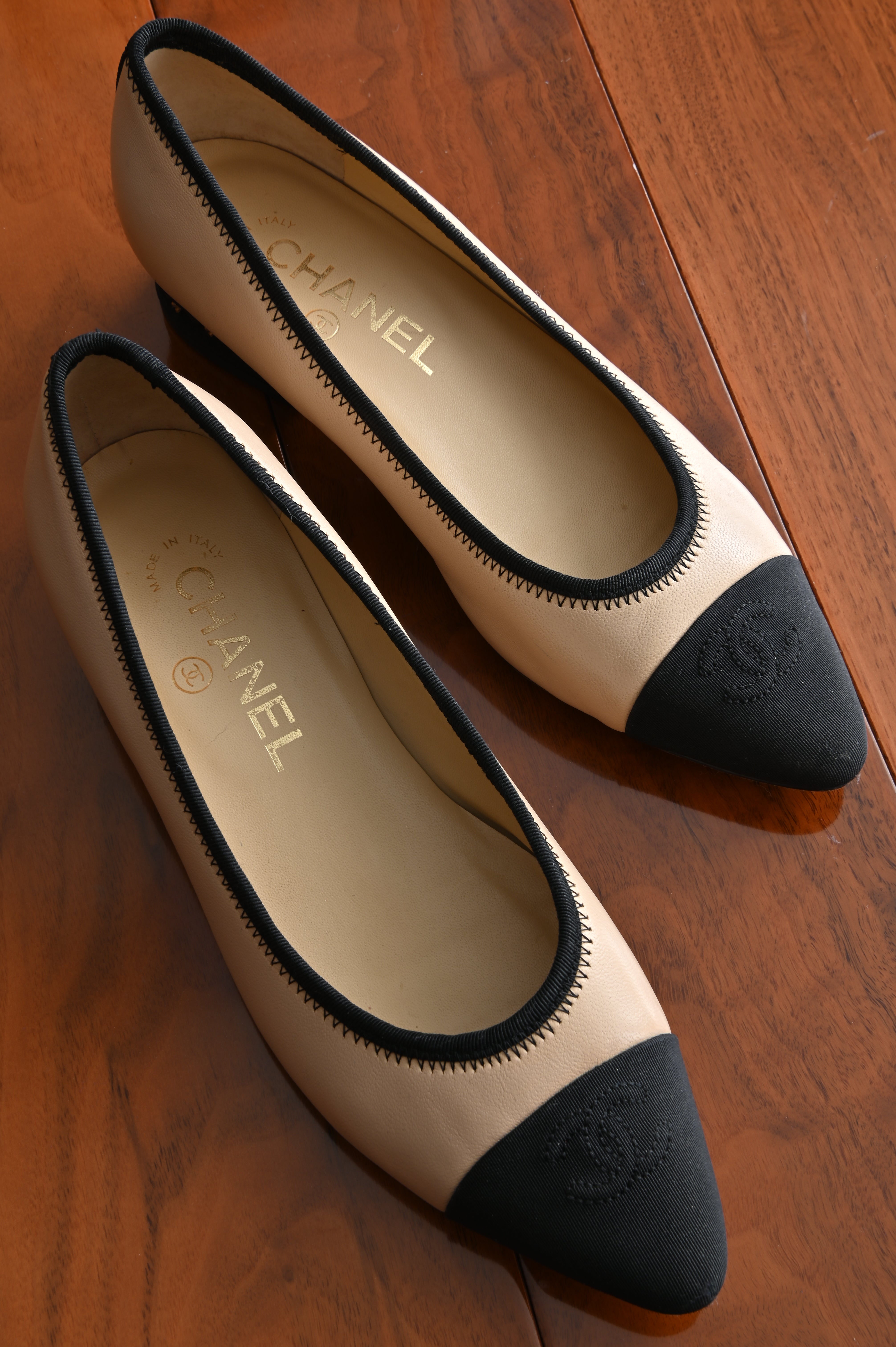 Chanel classic two-toned loafers with chain heel details