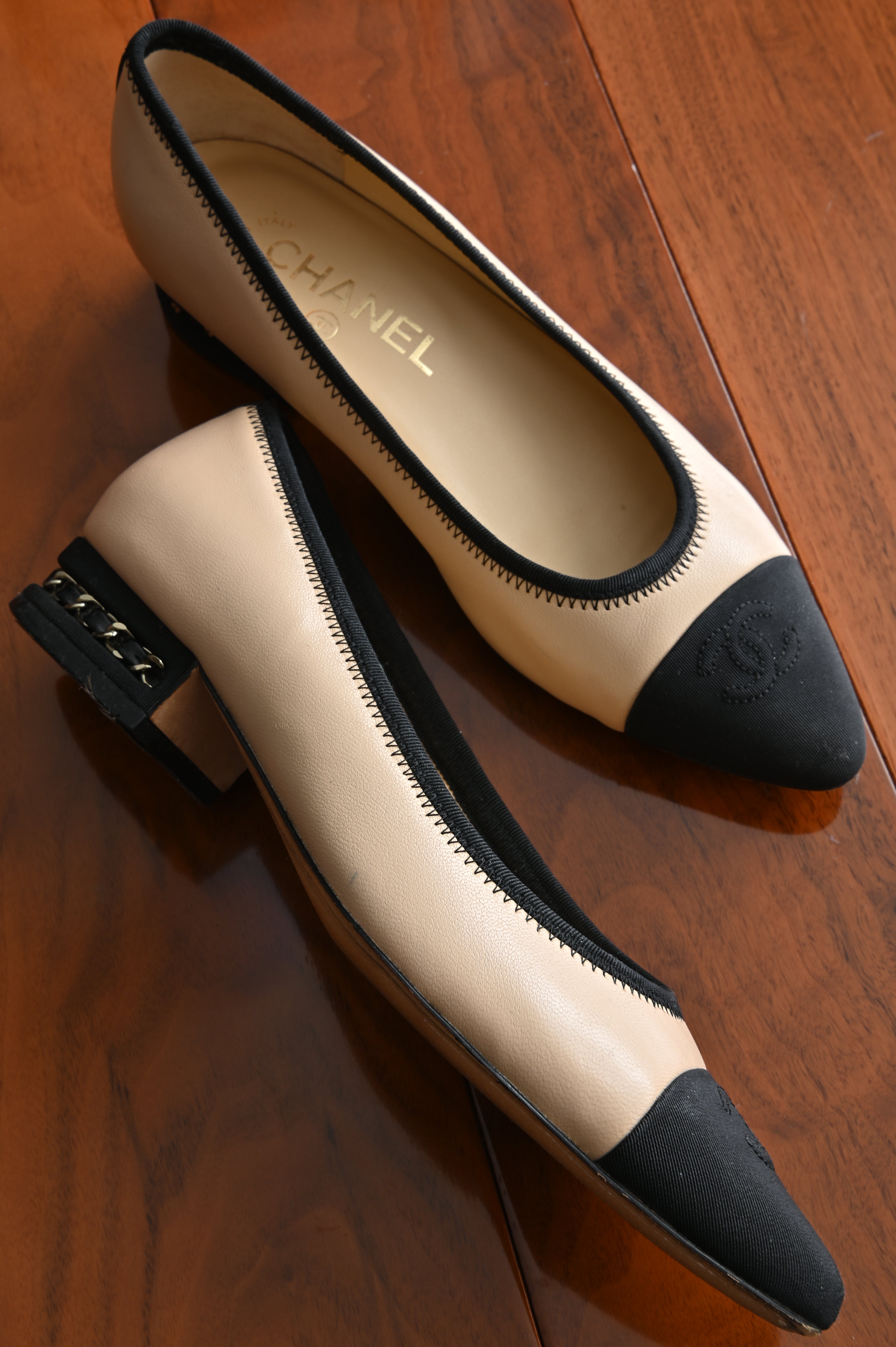 Chanel classic two-toned loafers with chain heel details