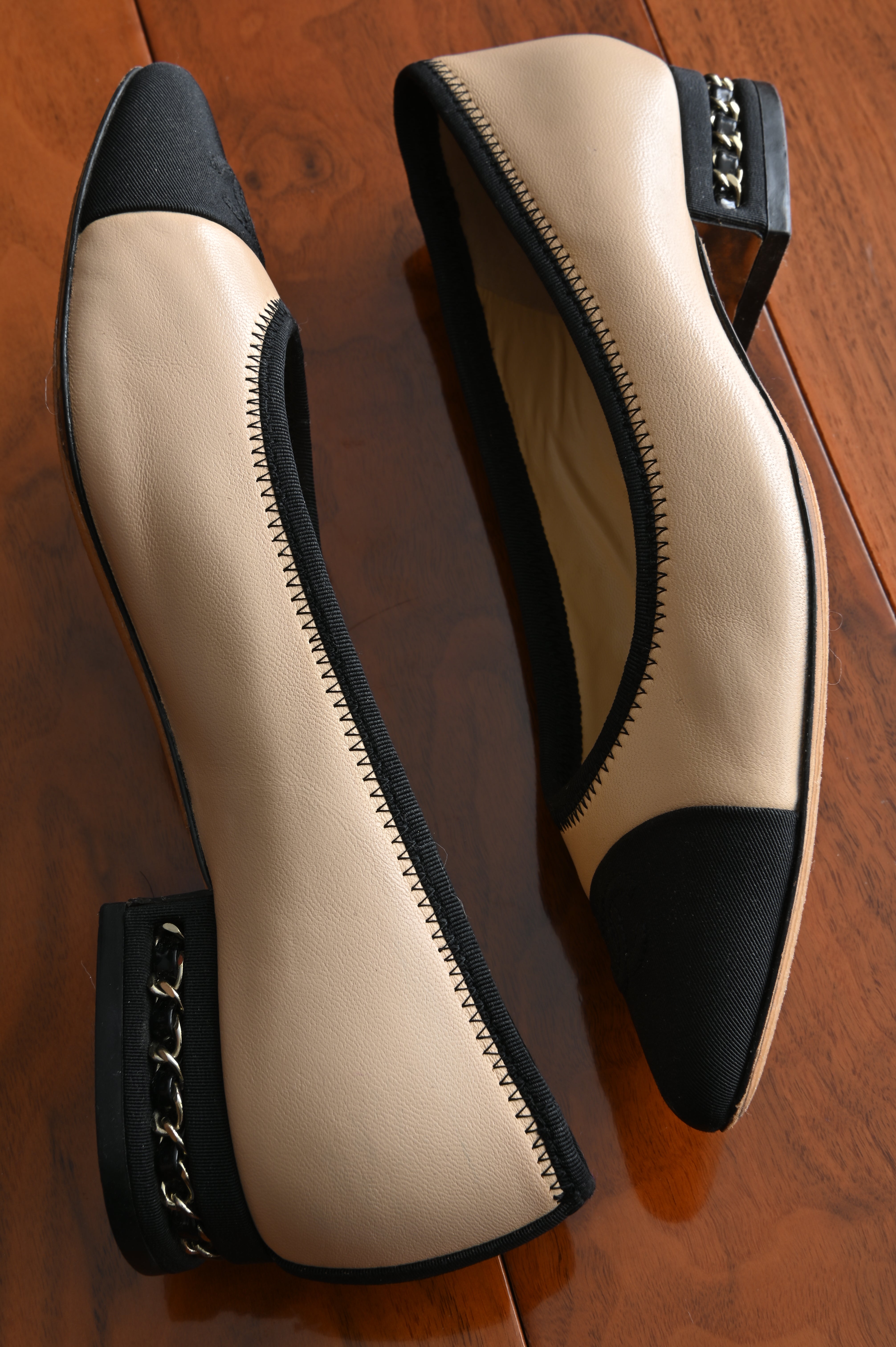 Chanel classic two-toned loafers with chain heel details