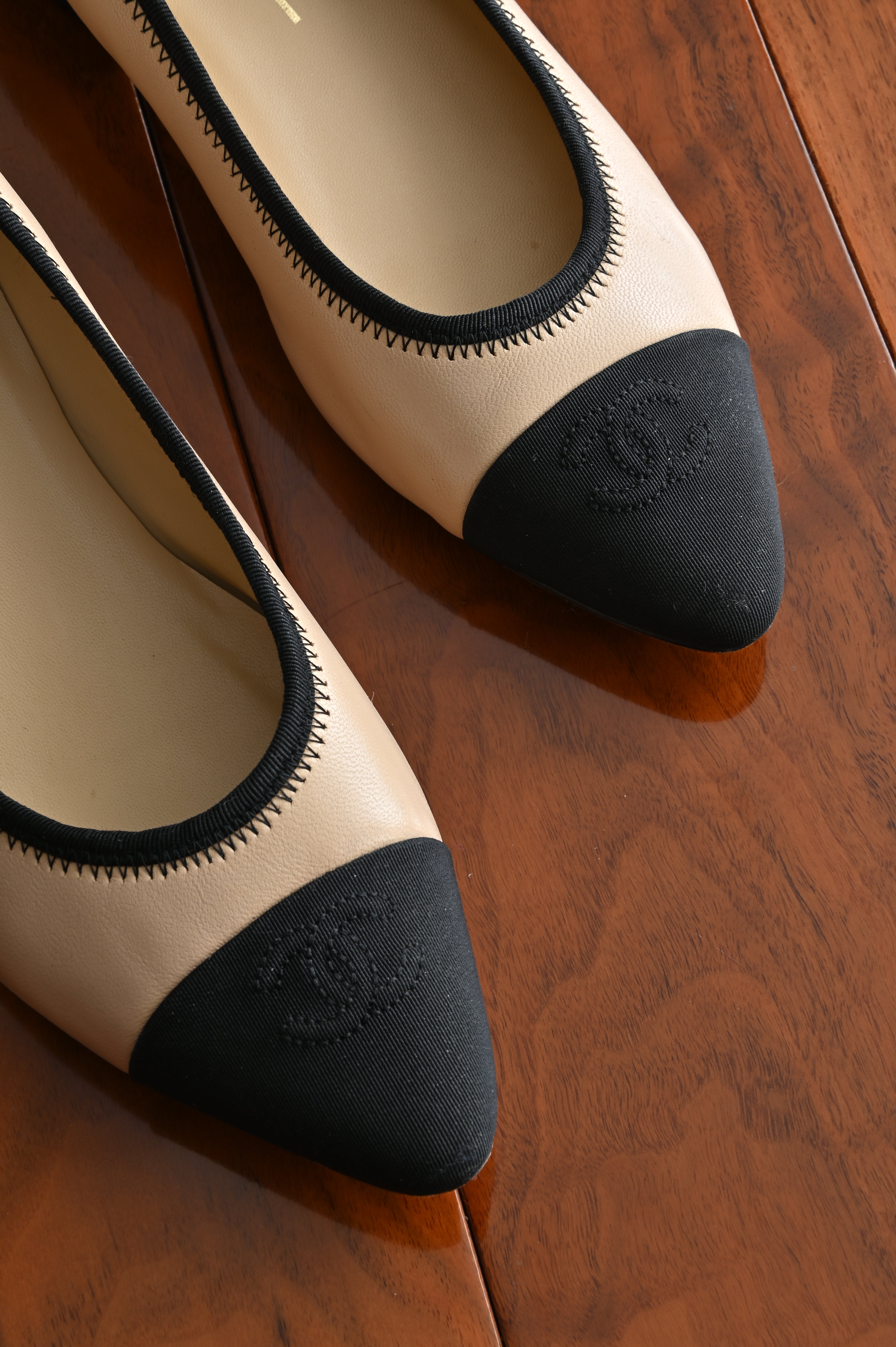 Chanel classic two-toned loafers with chain heel details