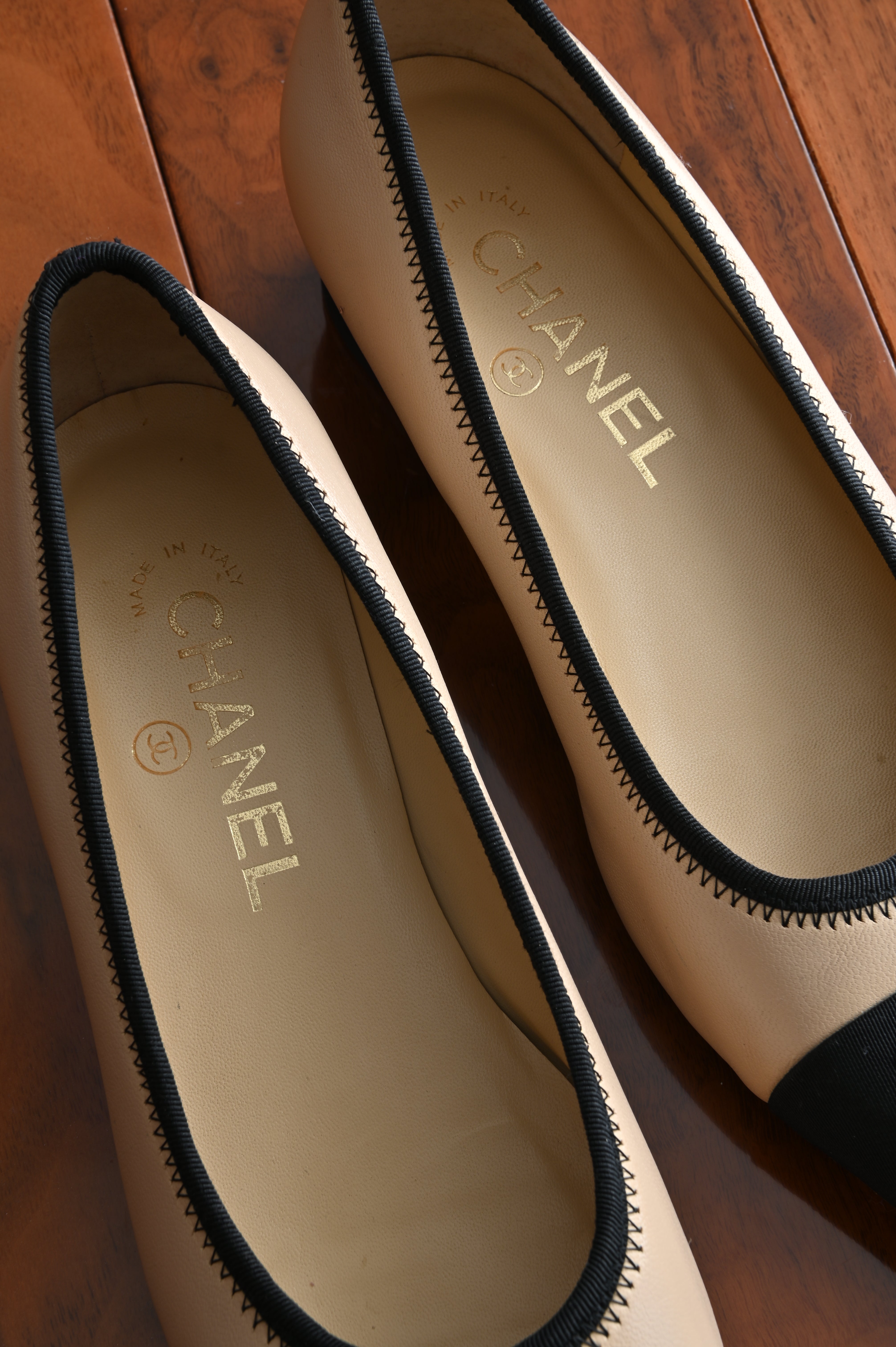 Chanel classic two-toned loafers with chain heel details