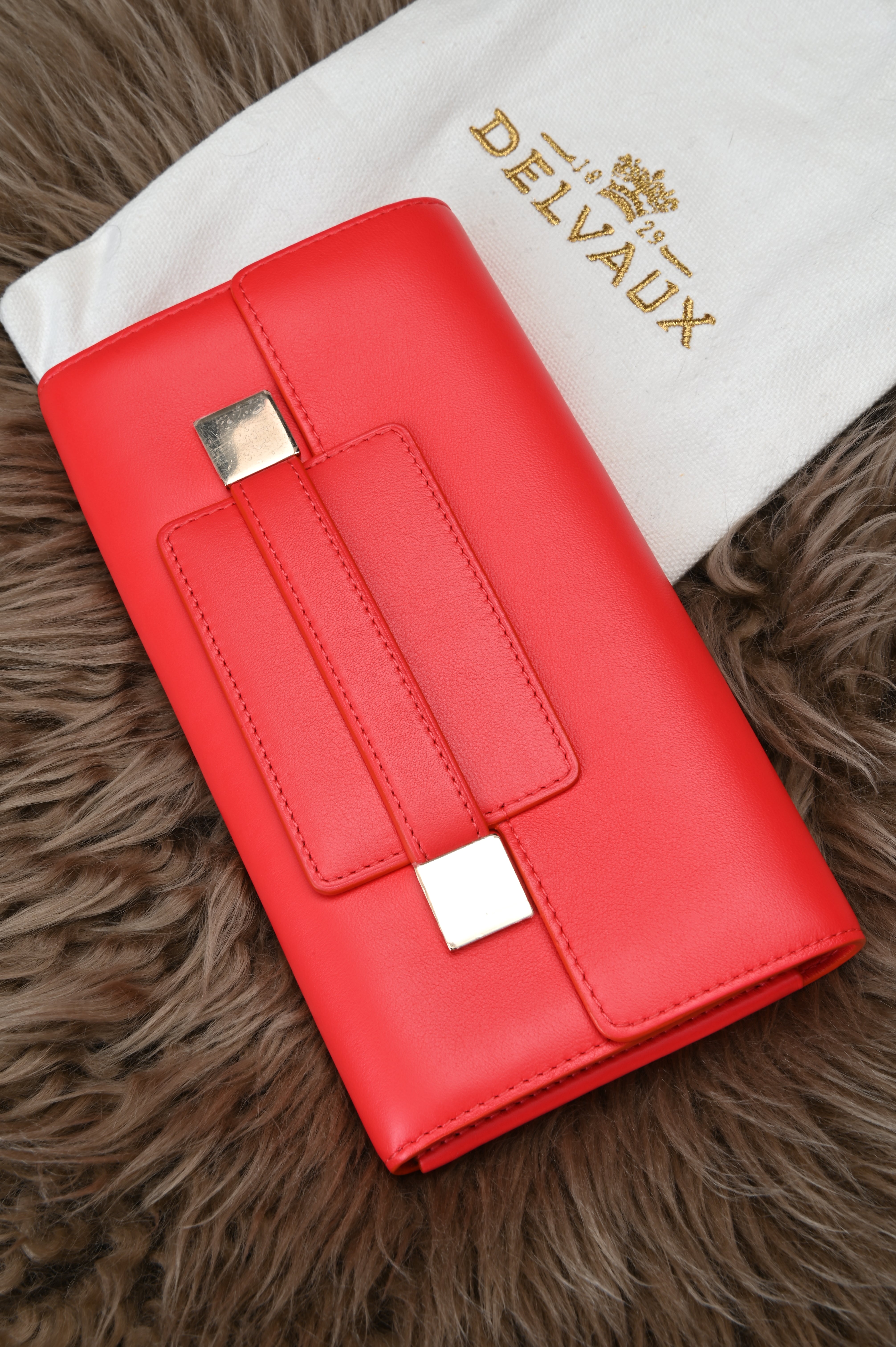 Delvaux Long flap wallet in light gold hardware
