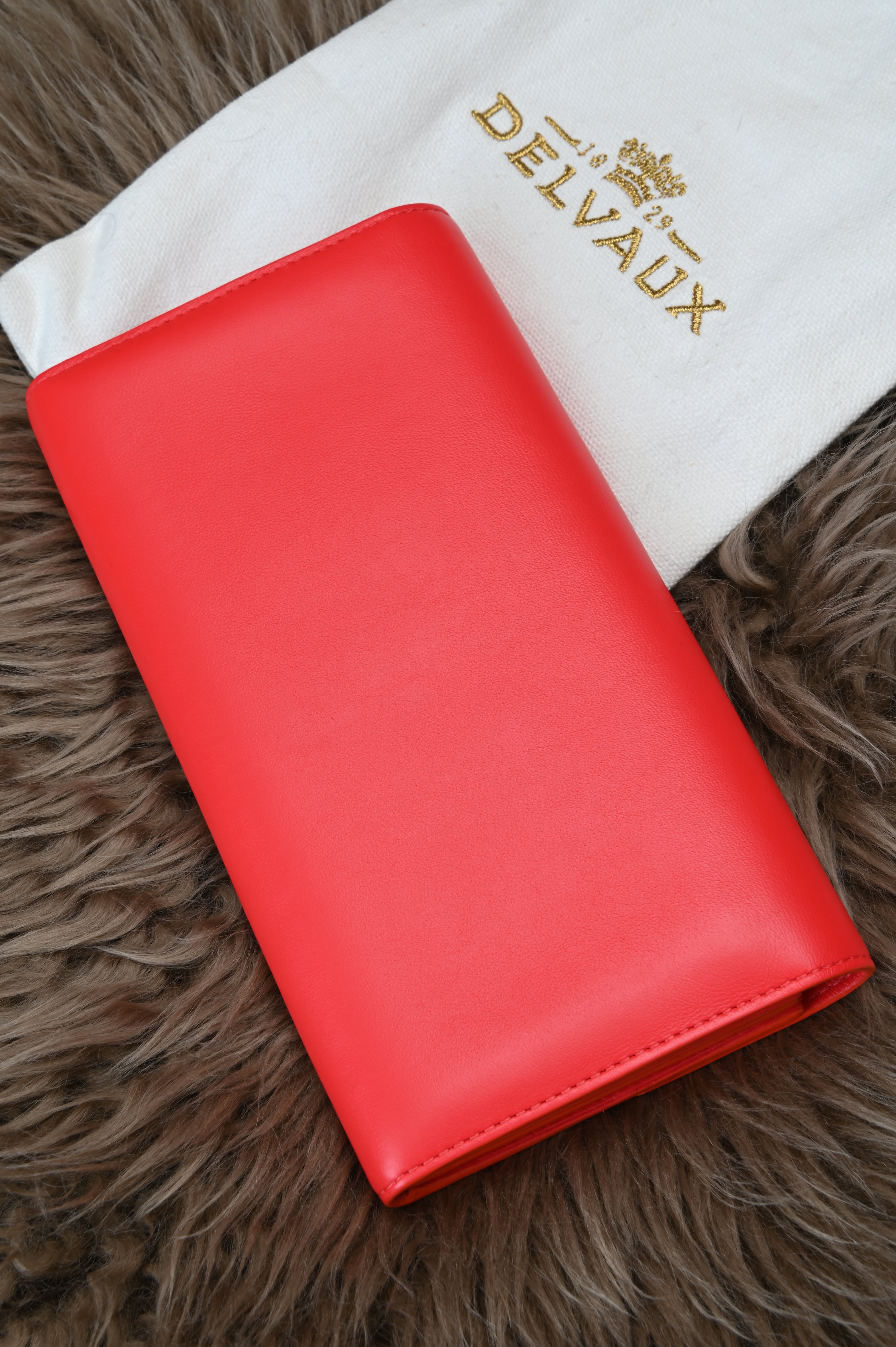 Delvaux Long flap wallet in light gold hardware