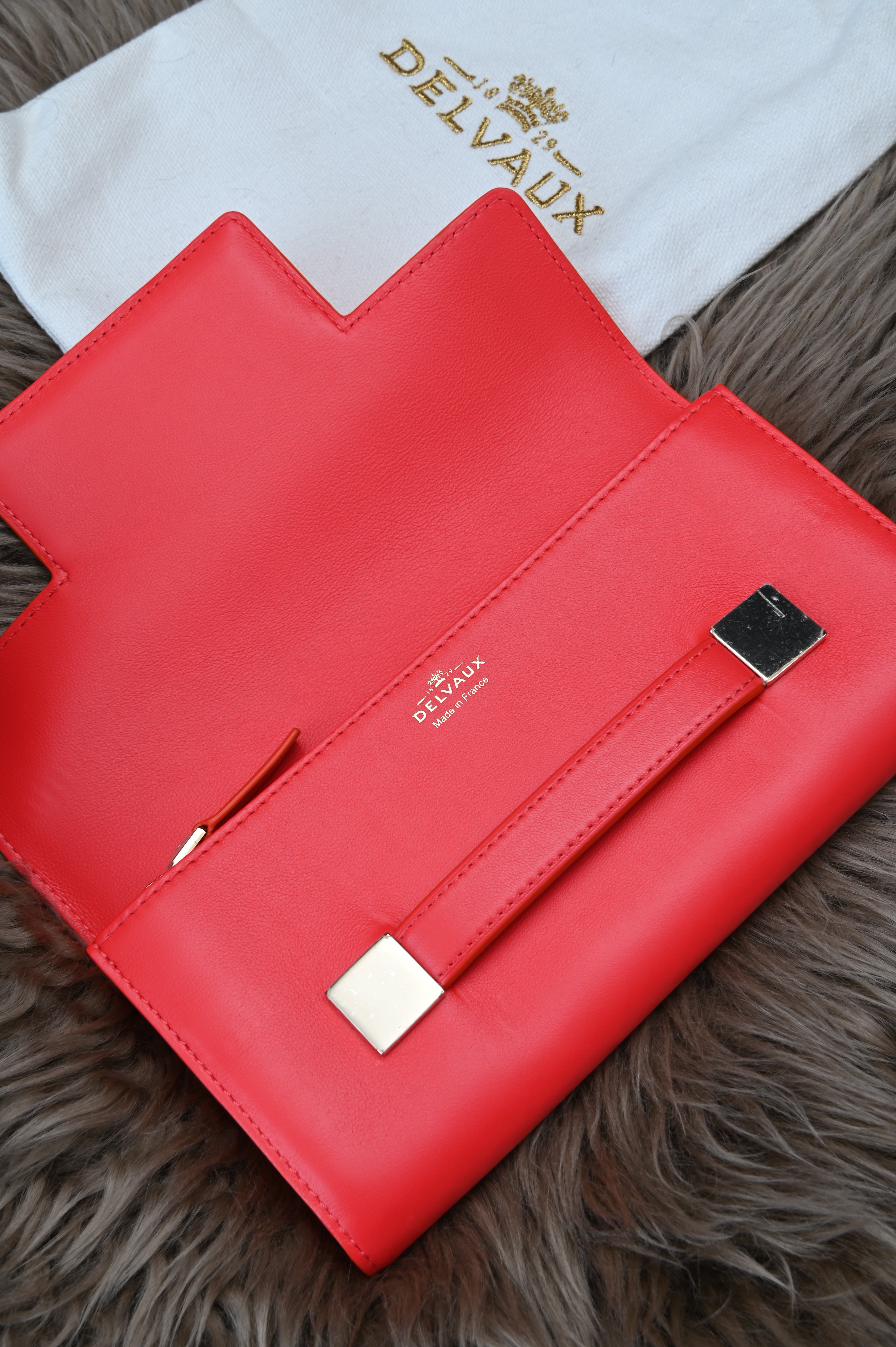 Delvaux Long flap wallet in light gold hardware