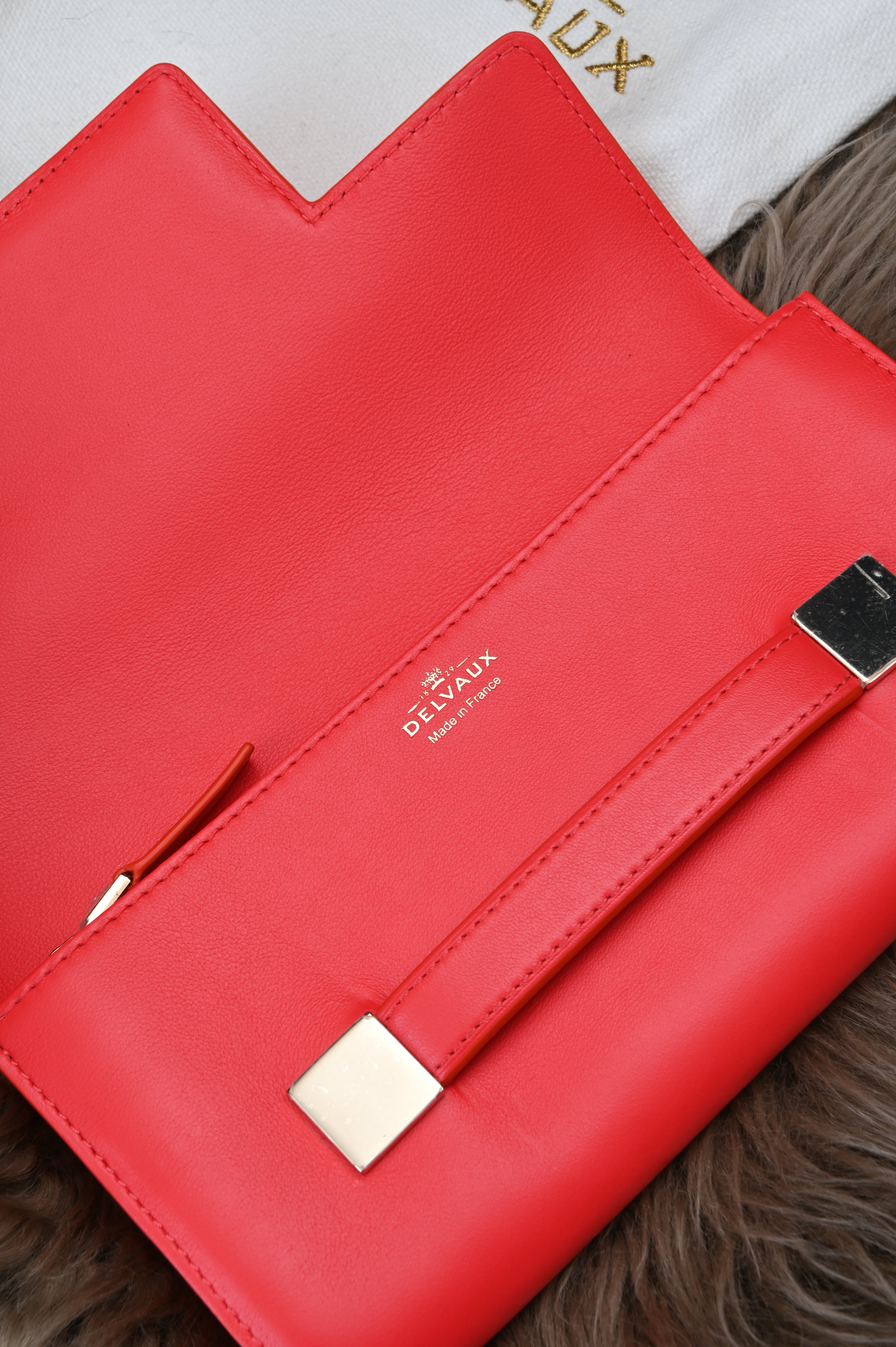 Delvaux Long flap wallet in light gold hardware