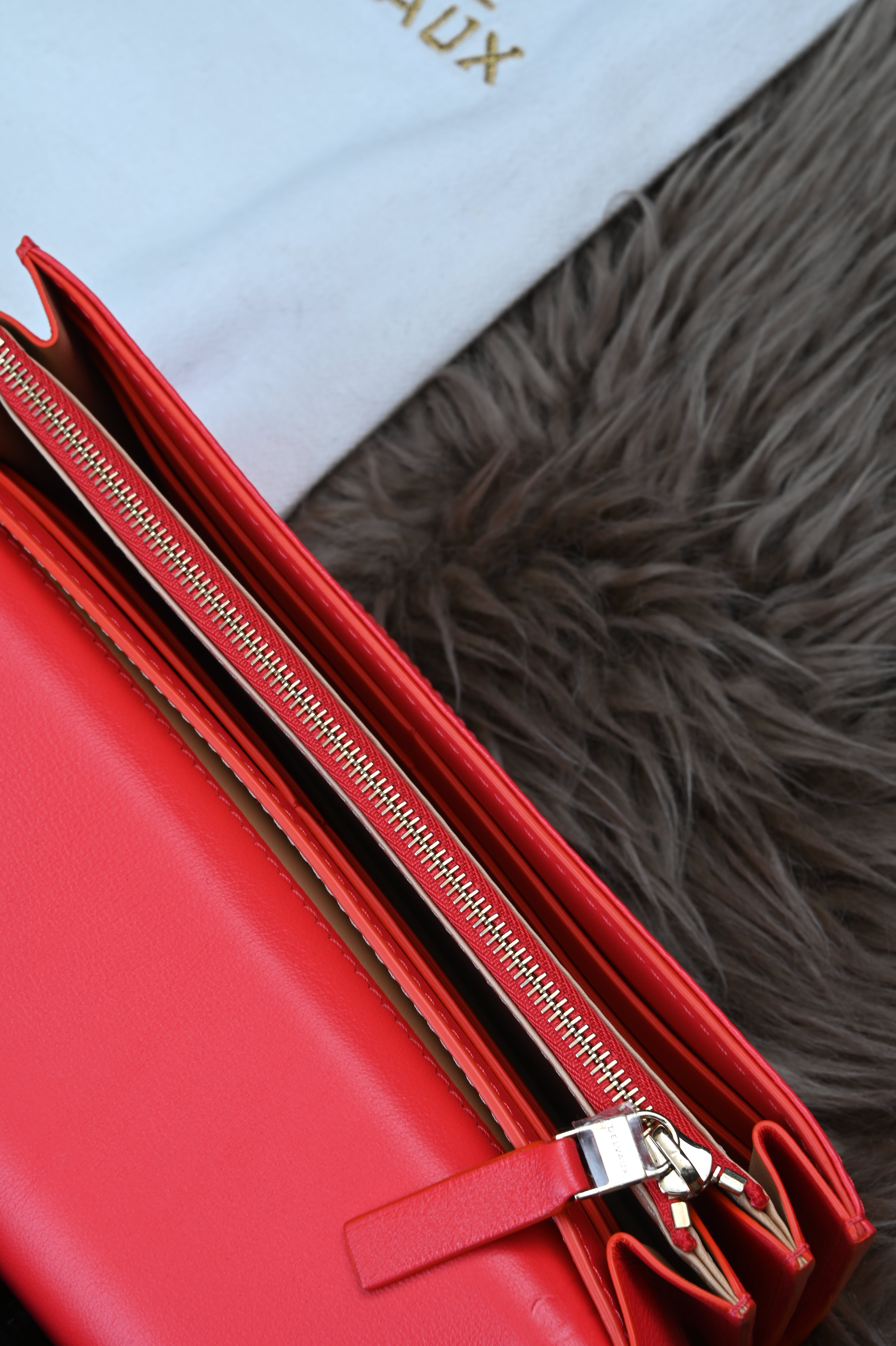 Delvaux Long flap wallet in light gold hardware