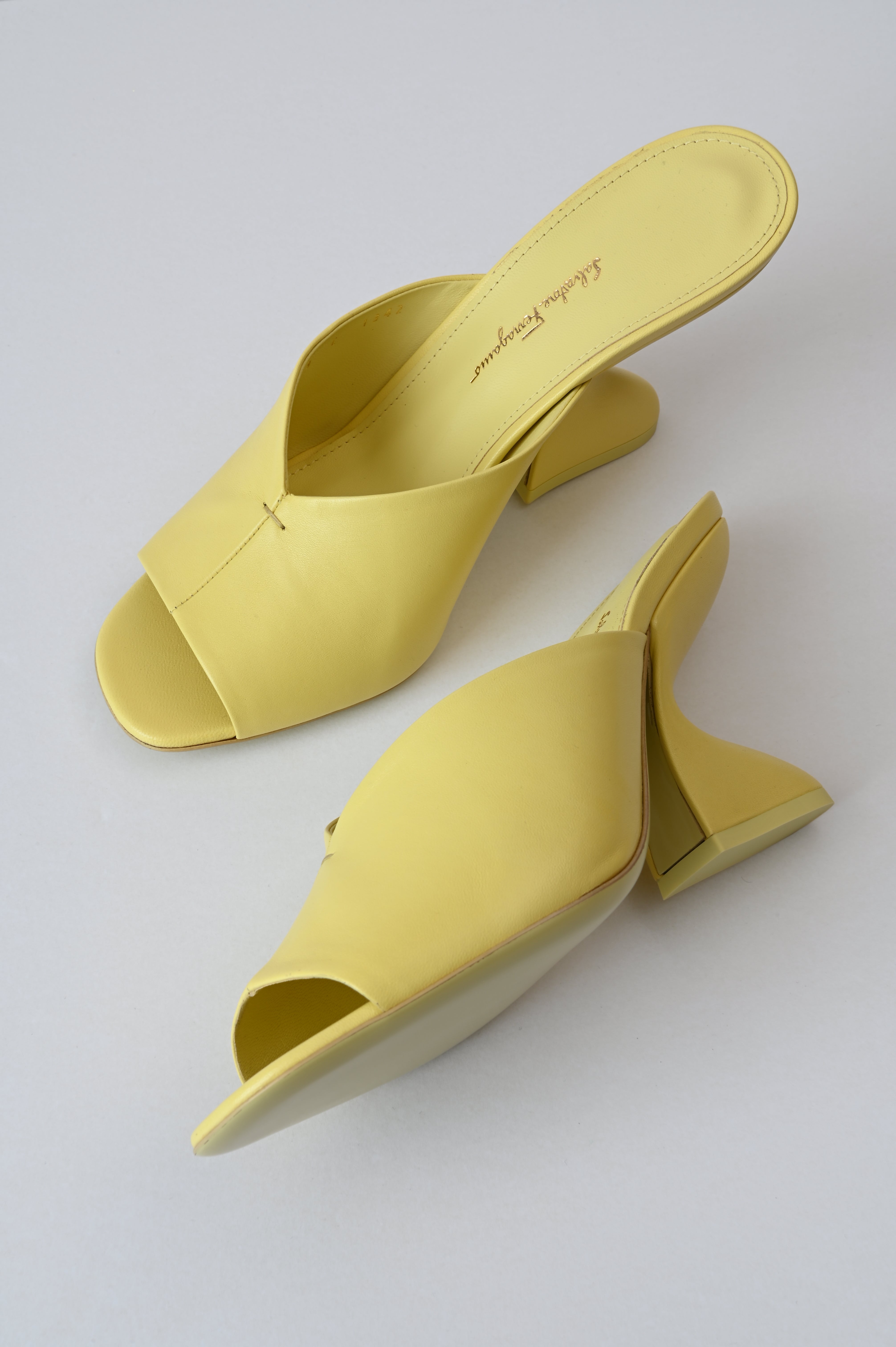 Salvatore Ferragamo Sansu f-heel slide sandal in Pastel yellow
