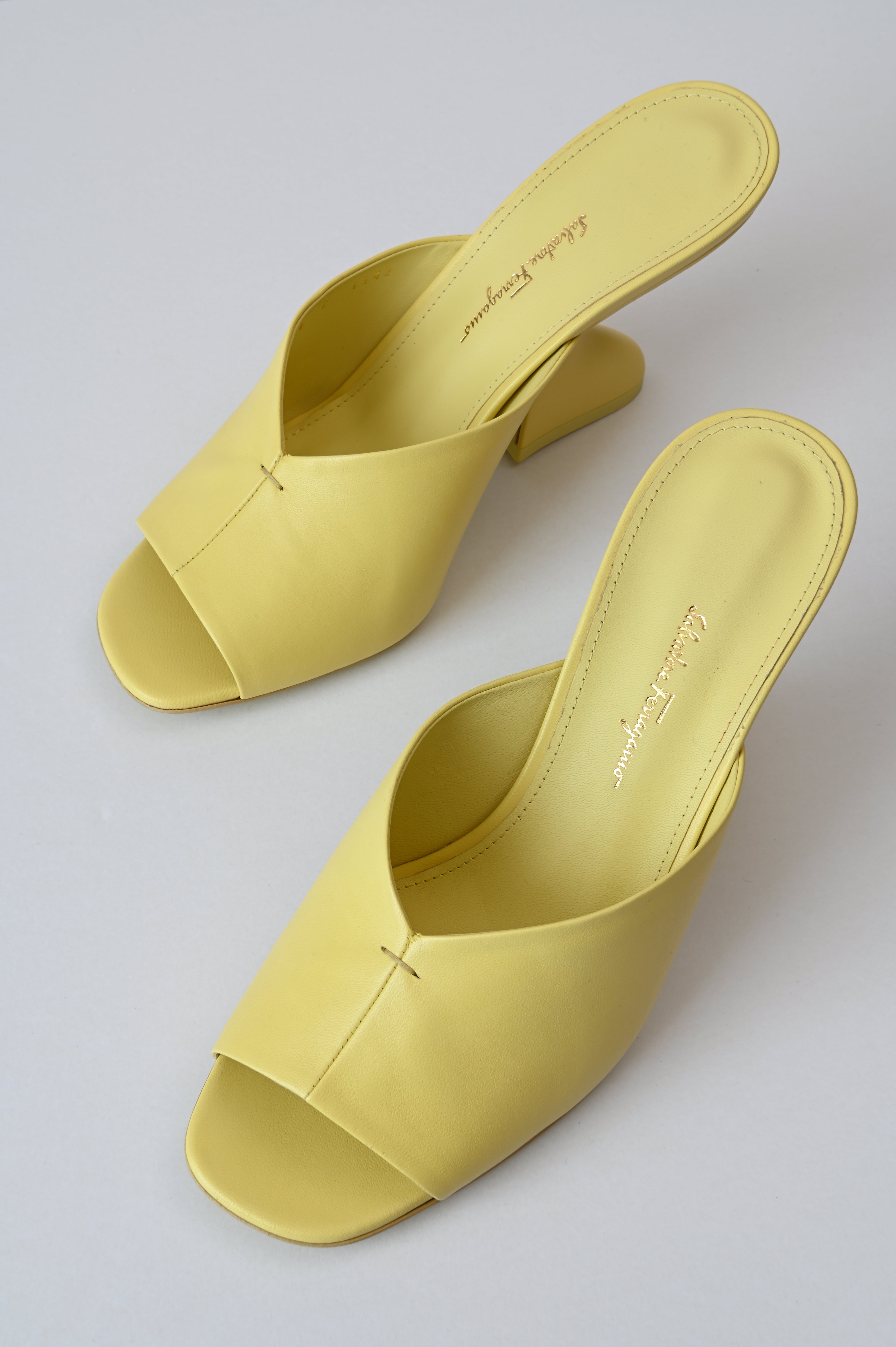 Salvatore Ferragamo Sansu f-heel slide sandal in Pastel yellow