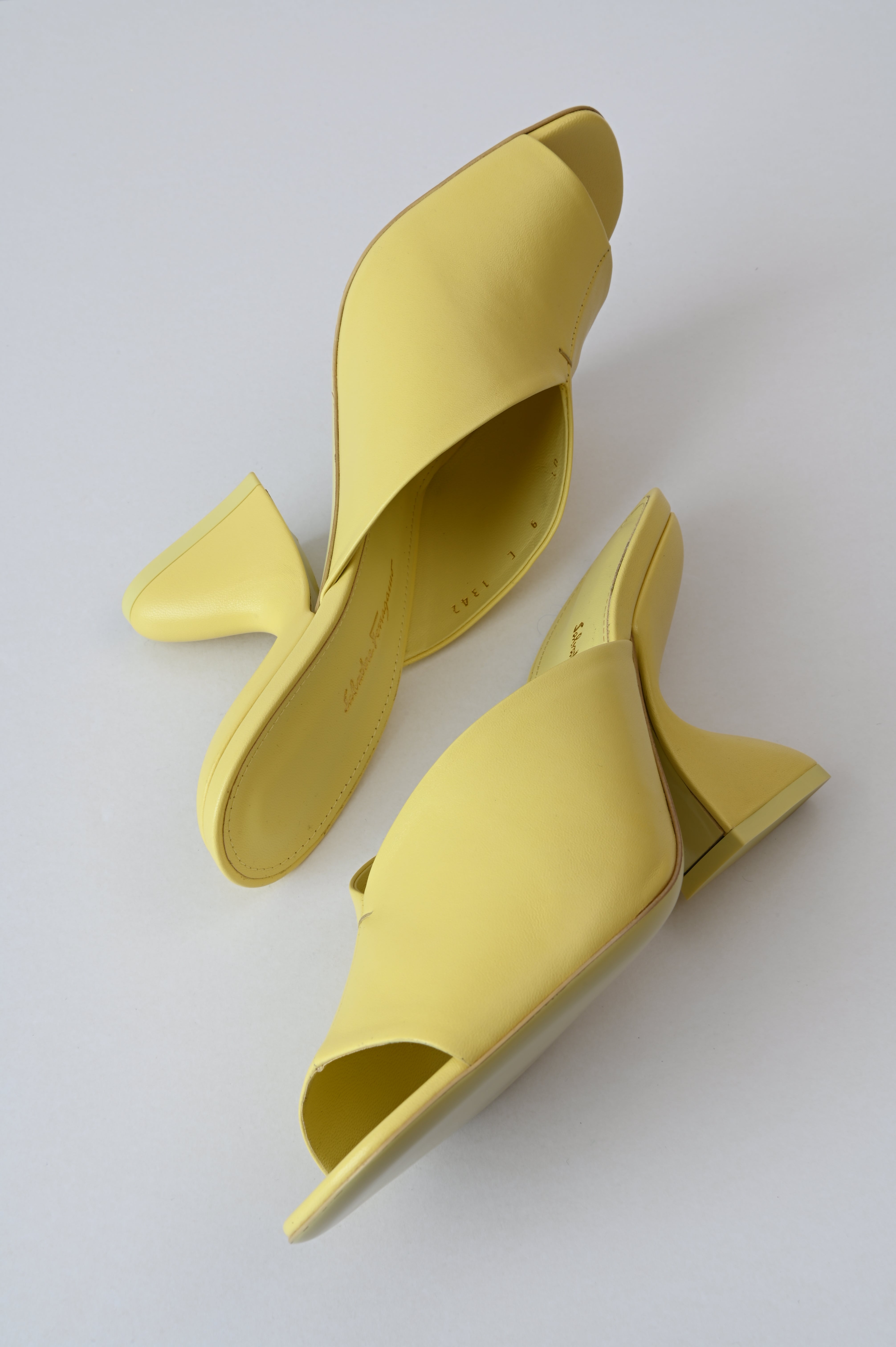 Salvatore Ferragamo Sansu f-heel slide sandal in Pastel yellow