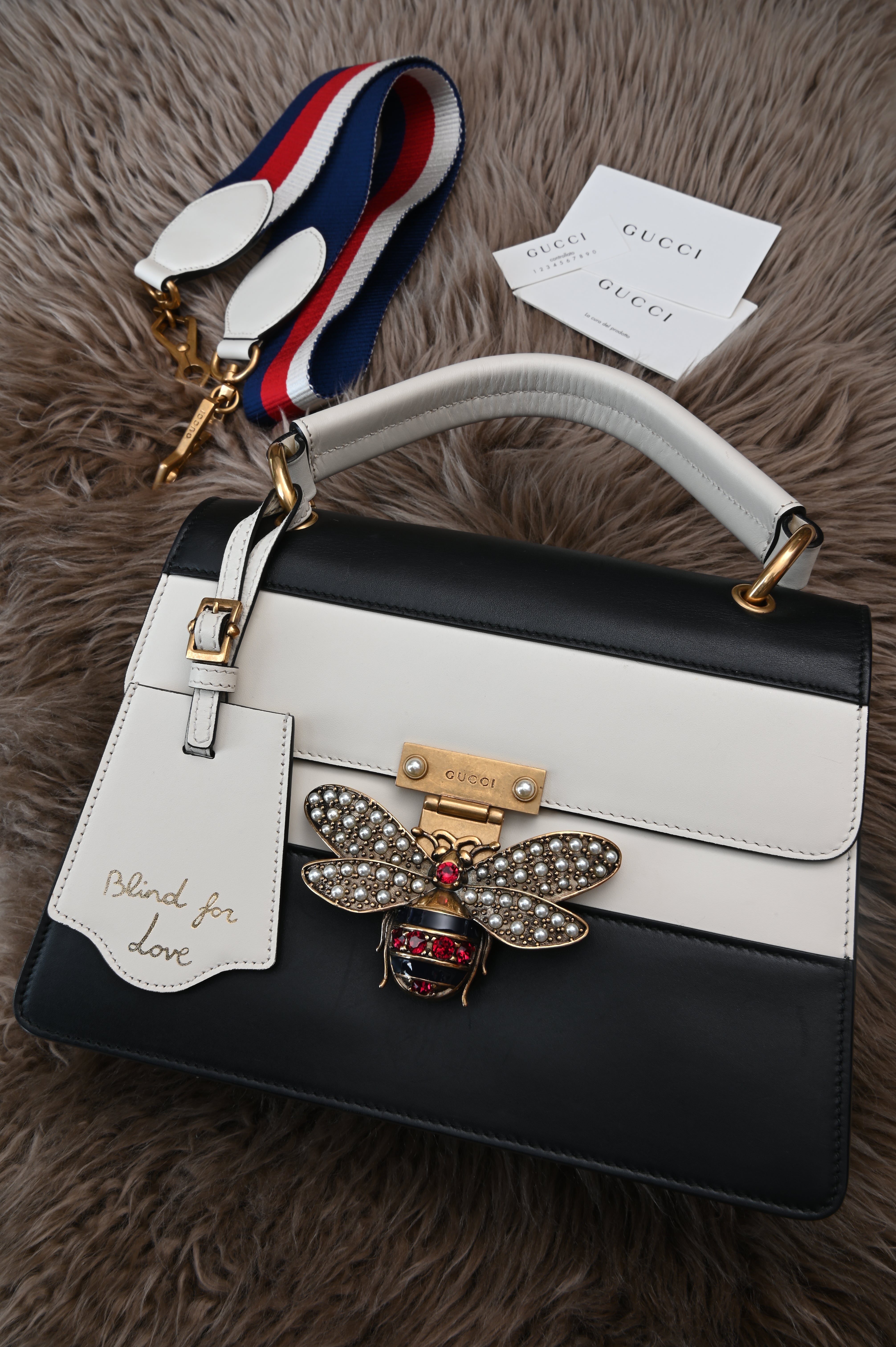 Gucci Queen Margaret Bee Top Handle bag in black and white