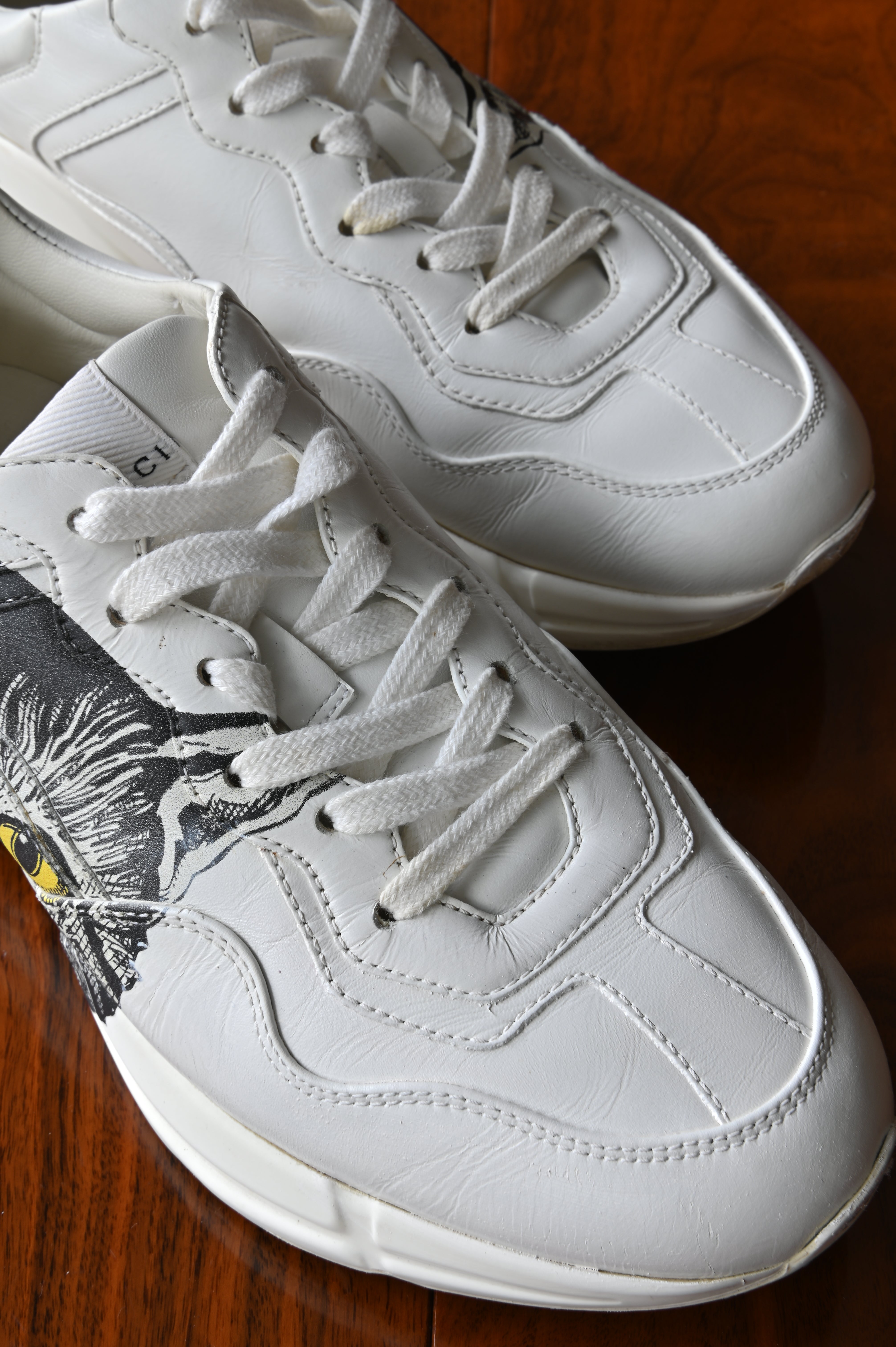 Authentic preloved Gucci White Rhyton Cat Sneakers – premium white leather detail
