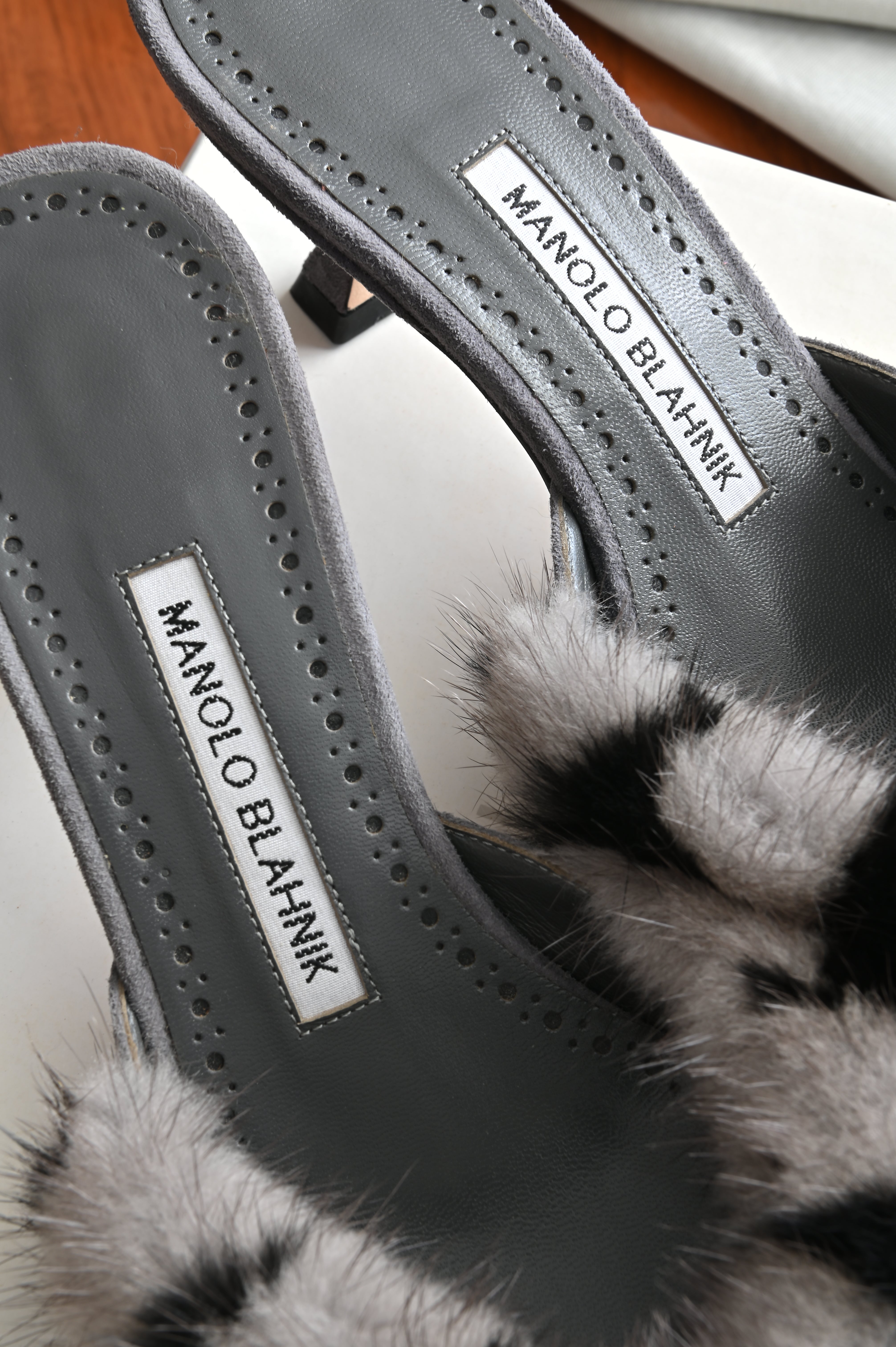 Manolo Blahnik Fur Mules logo