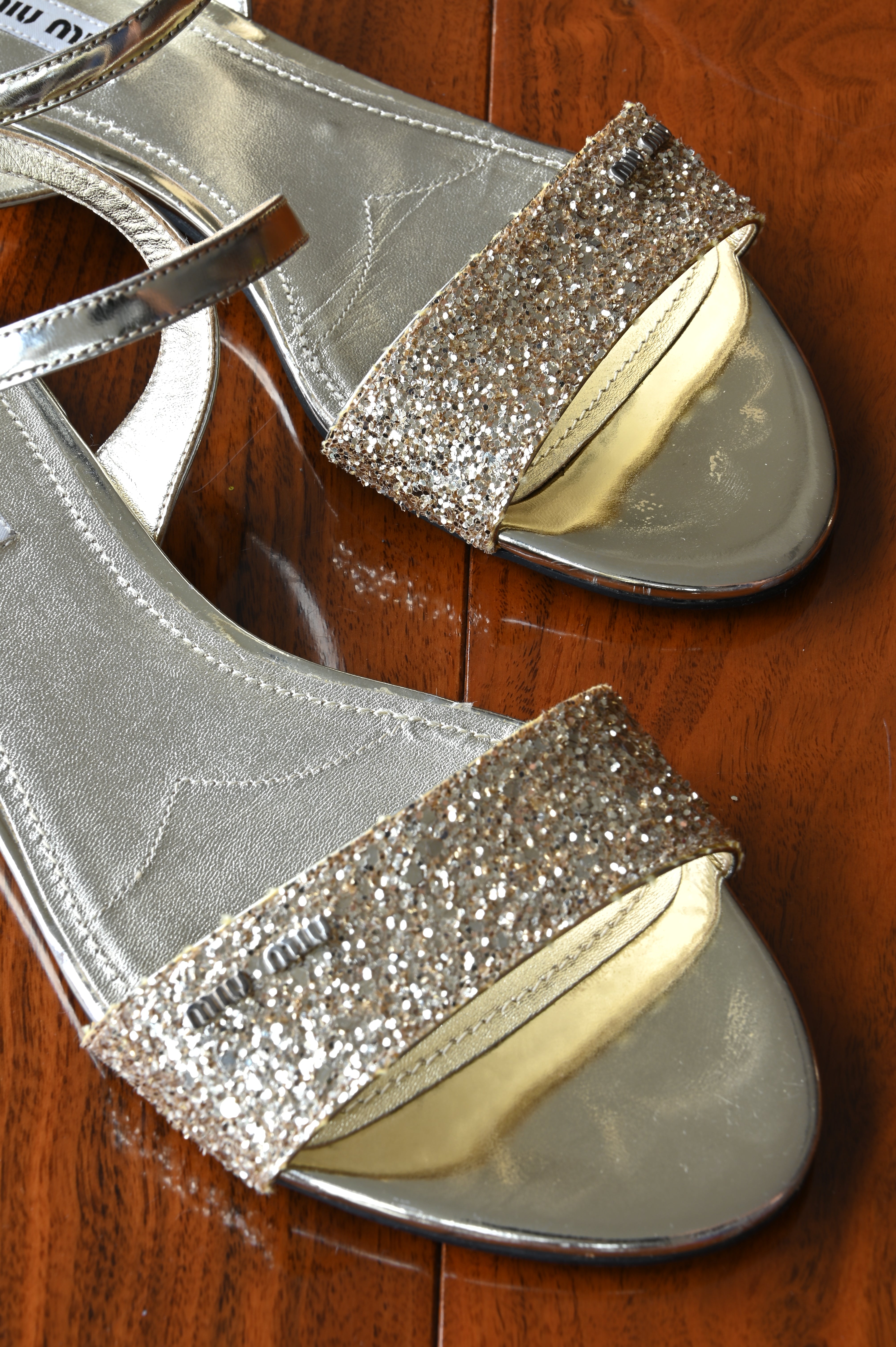 Miu Miu Gold Glitter Flats front