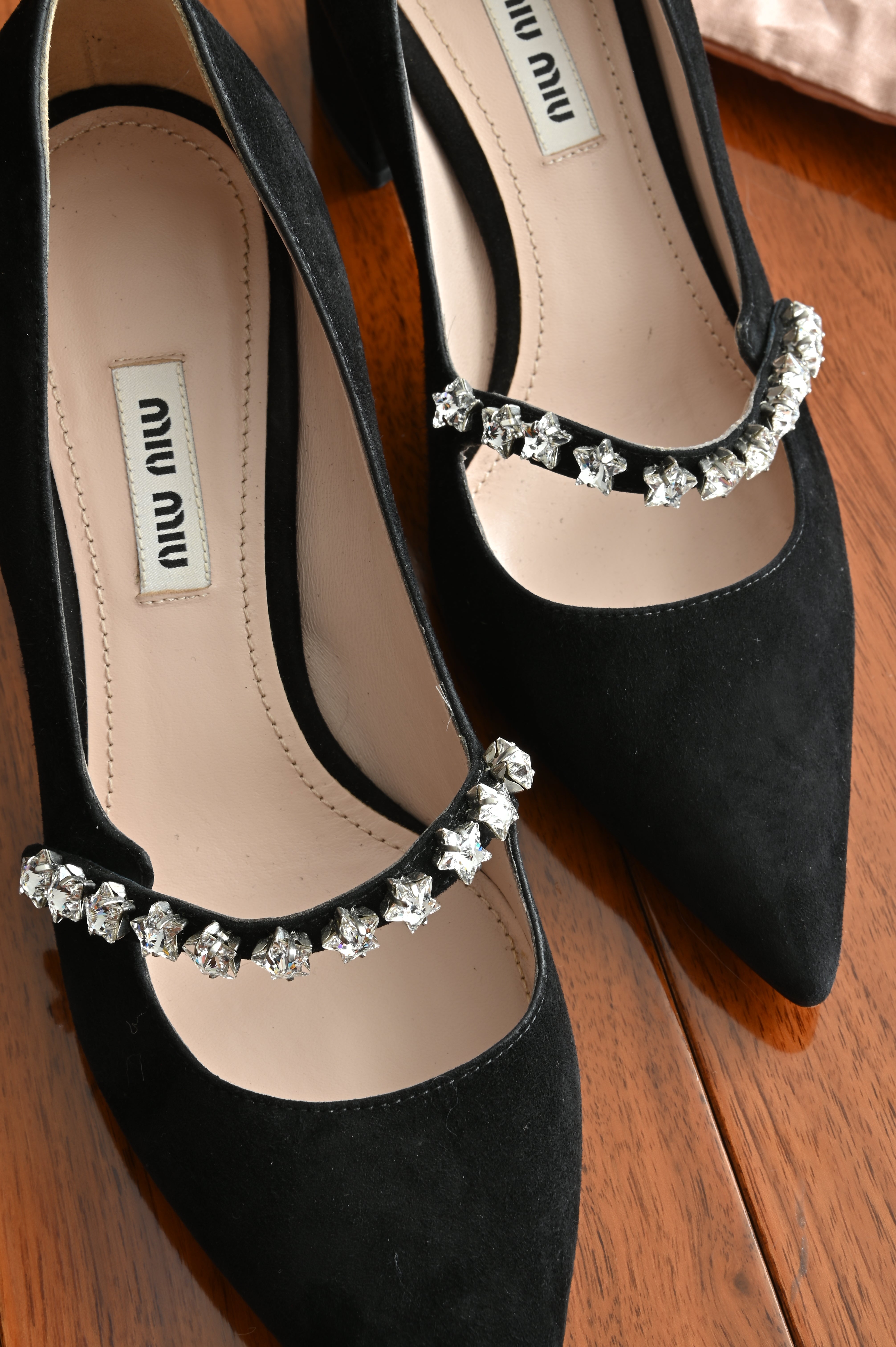 Miu Miu Mary Jane Heels logo