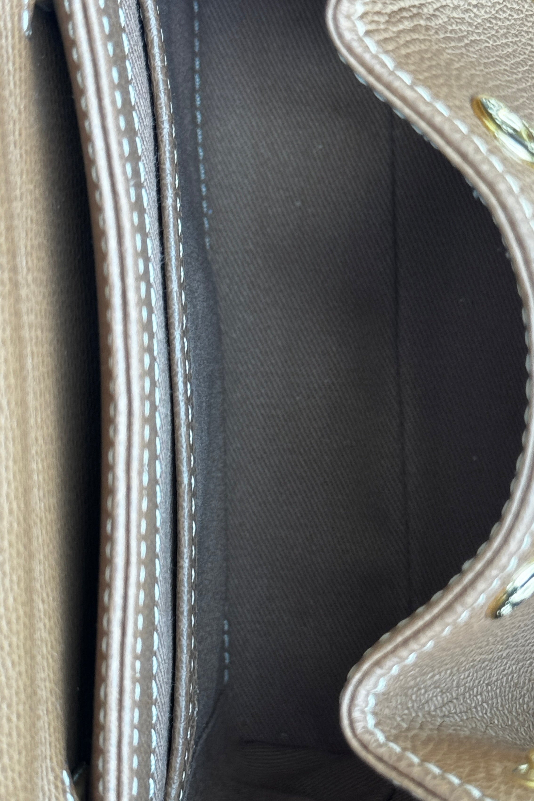 Authentic preloved Polène Numéro Un Nano Bag in Trio Camel, interior view showcasing the leather-lined compartment and storage space.