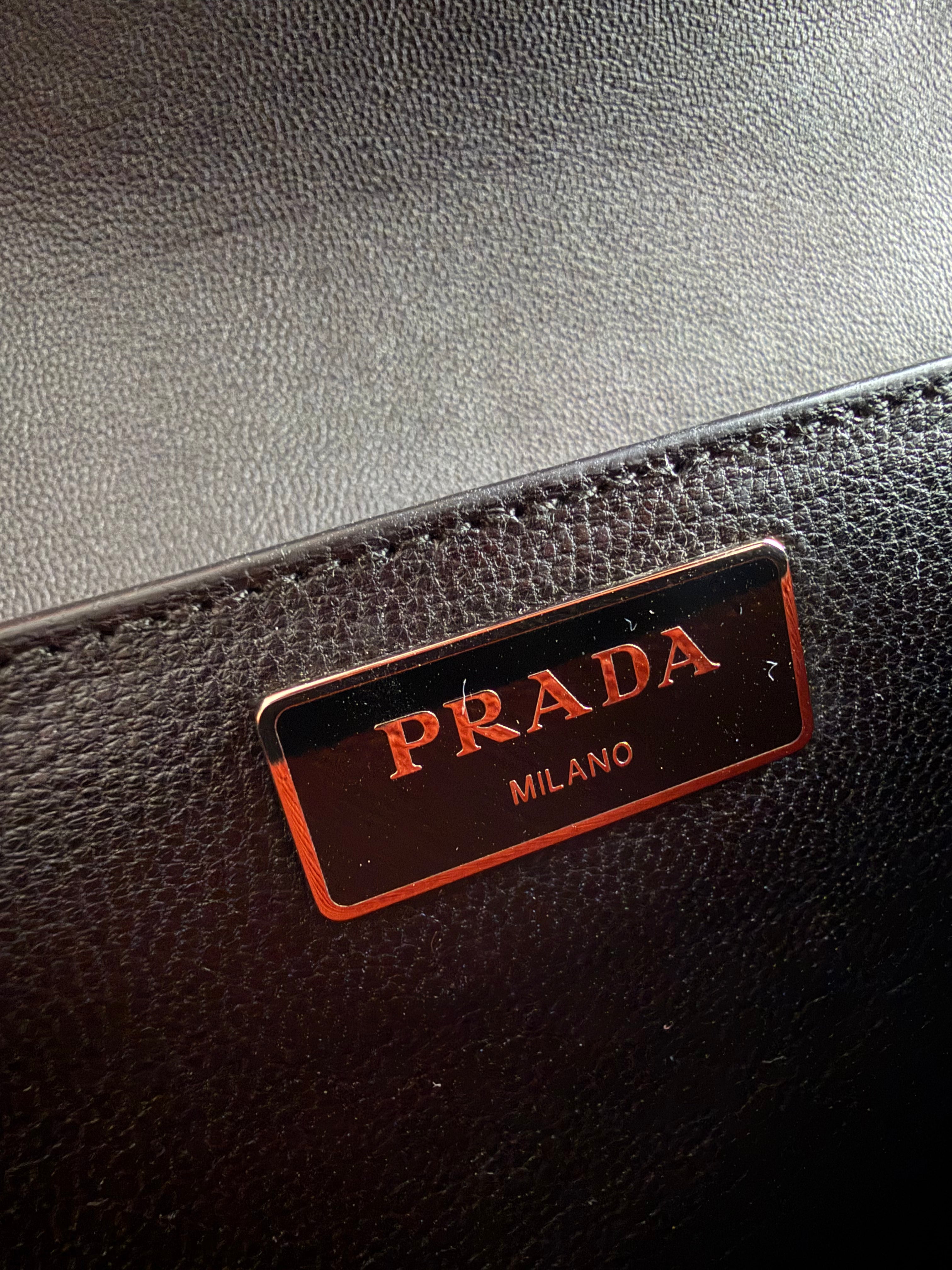 Prada two-way clutch bag Saffiano Lux in Fuoco Papaya logo