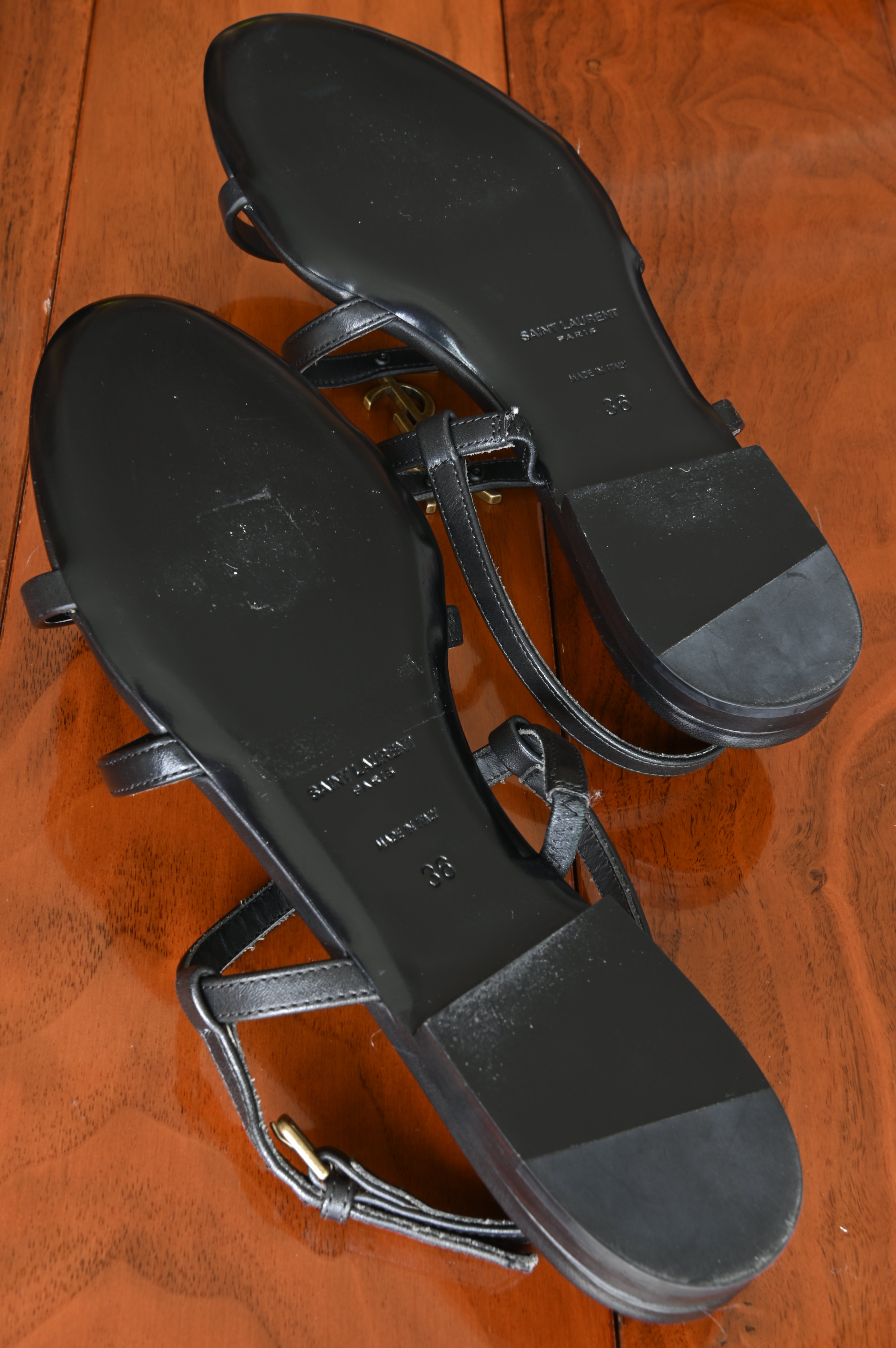 Saint Laurent Black Cassandra Flat Thong Sandals bottom