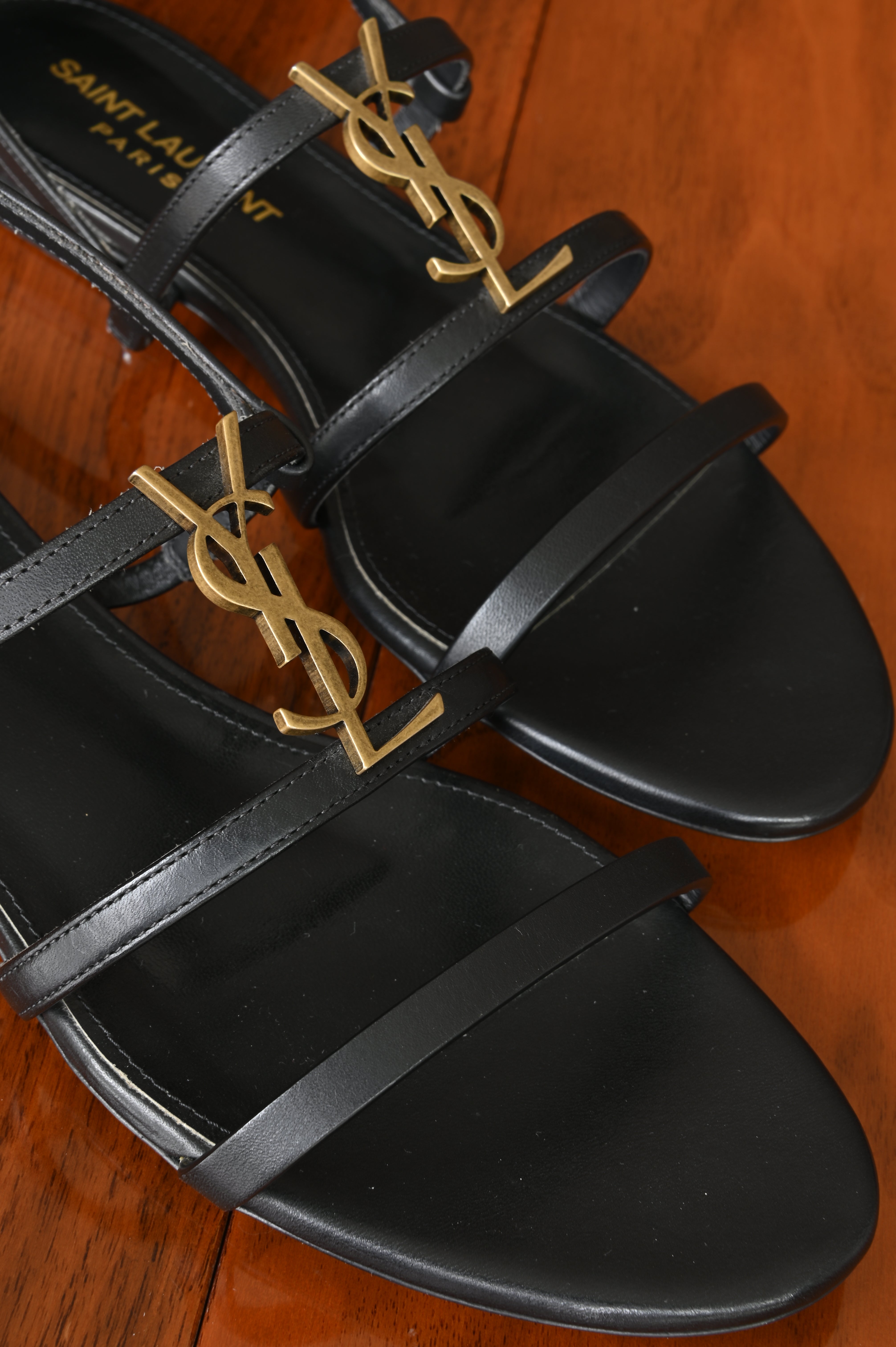 Saint Laurent Black Cassandra Flat Thong Sandals front