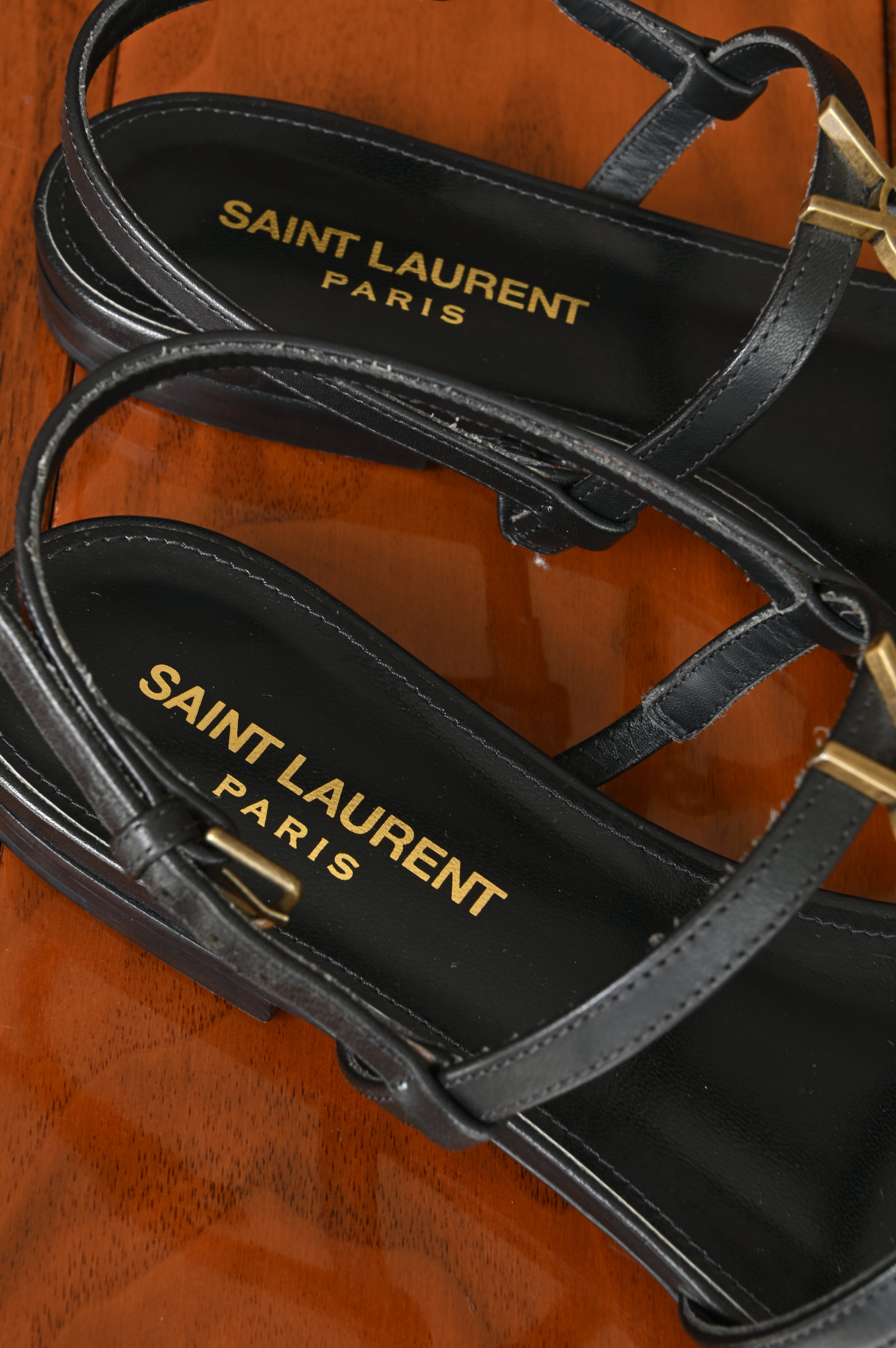 Saint Laurent Black Cassandra Flat Thong Sandals logo