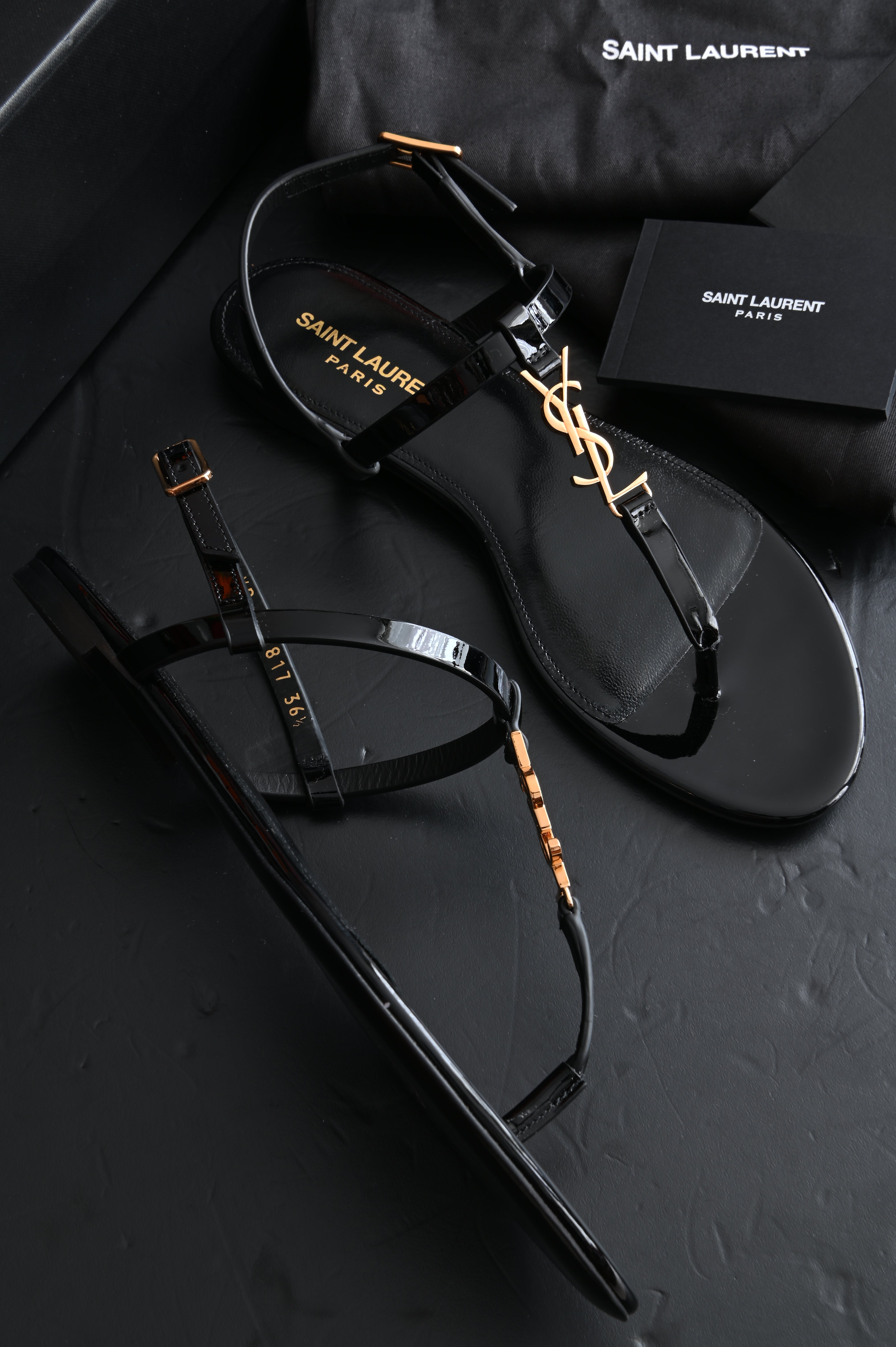 Saint Laurent Cassandra Thong sandals flats in patent and gold hardware