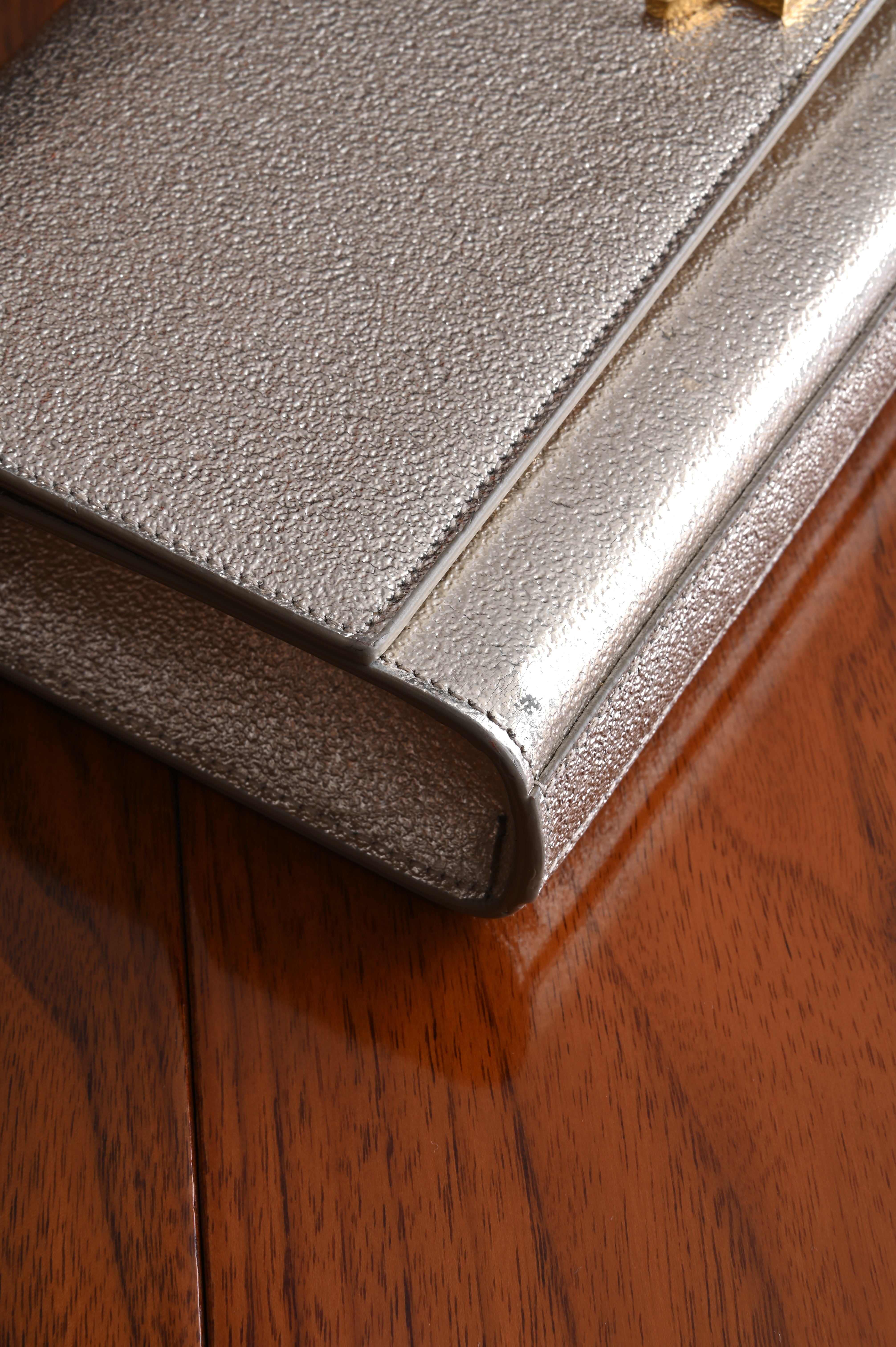 Saint Laurent Metallic Gold clutch left corner