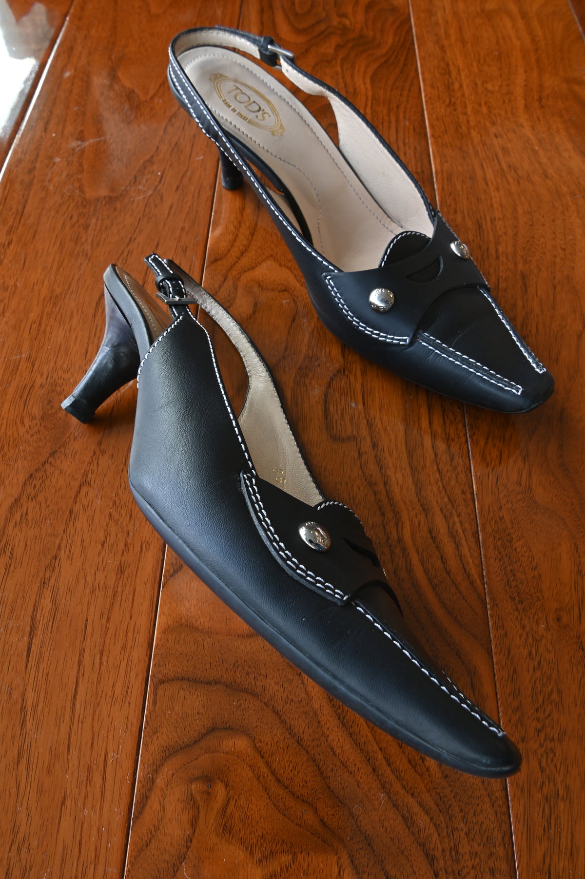 Tod's Black Leather Pointed Slingback Heels left