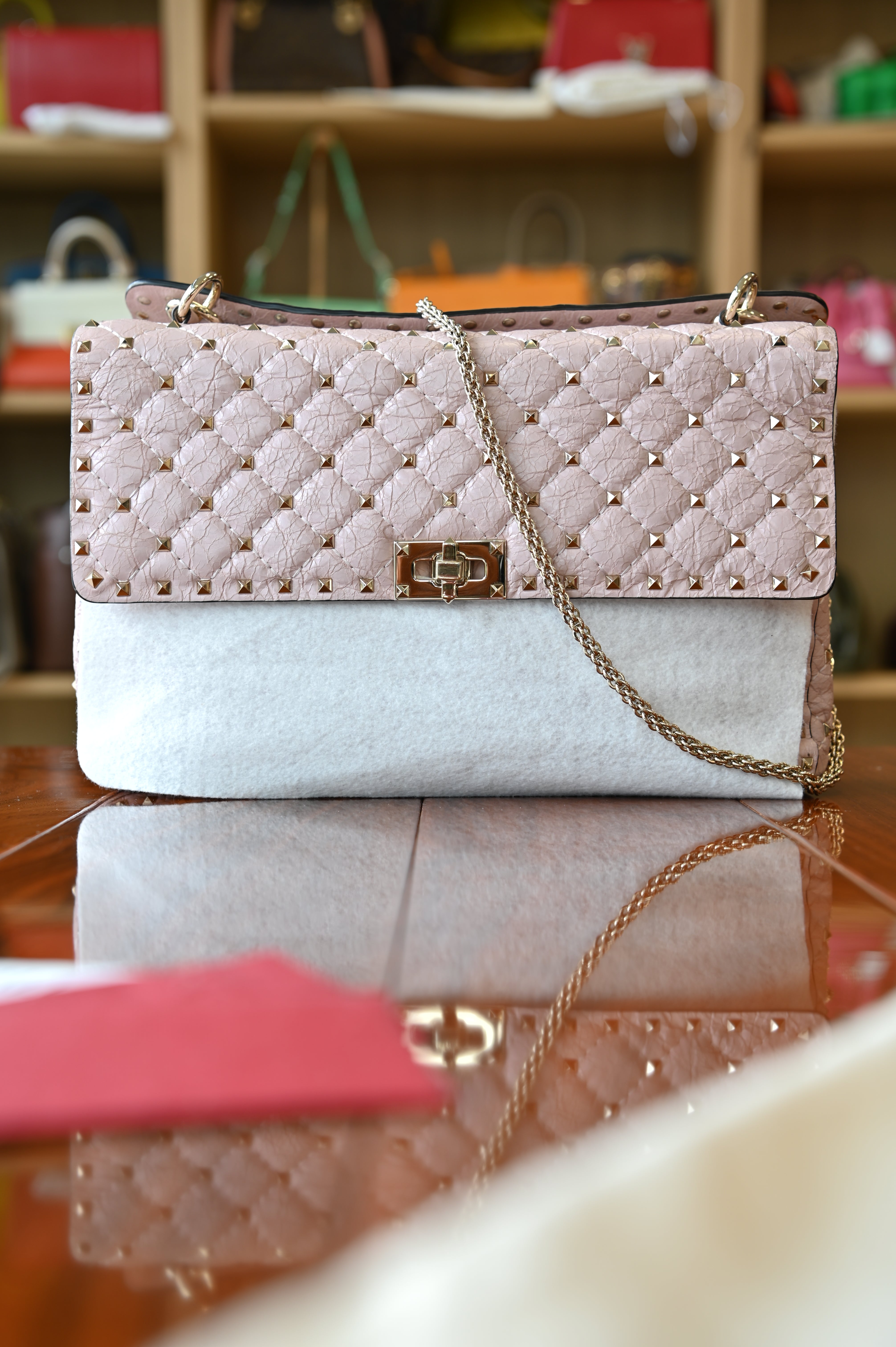 Preloved Valentino Garavani Pink Rockstud Shoulder Bag in blush pink leather featuring signature gold-tone Rockstud embellishments, structured silhouette, adjustable shoulder strap, and elegant luxury design