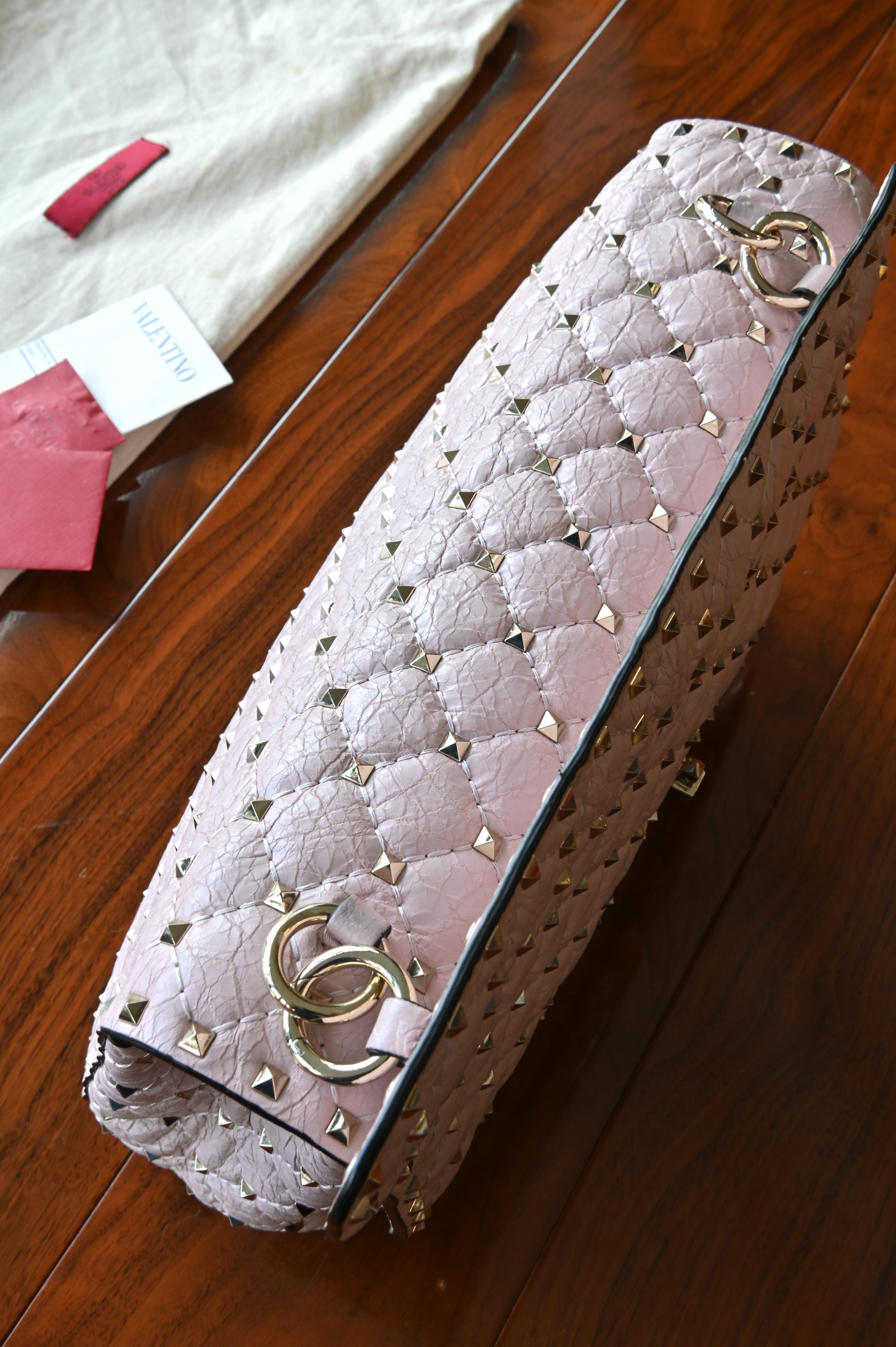 Preloved Valentino Garavani Pink Rockstud Shoulder Bag in blush pink leather featuring signature gold-tone Rockstud embellishments, structured silhouette, adjustable shoulder strap, and elegant luxury design