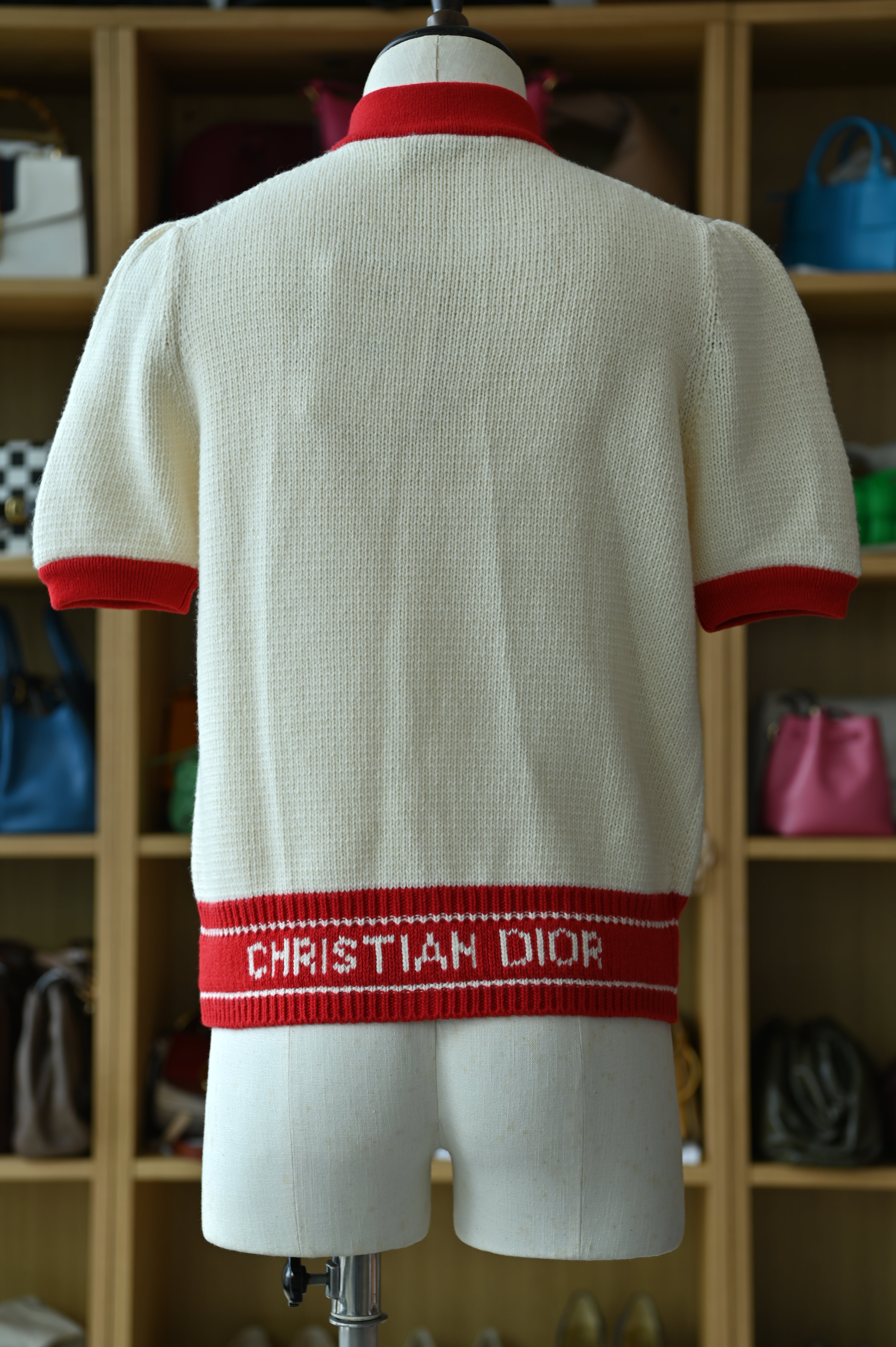 Authentic Christian Dior White & Red Knit Cardigan showing the rear view with signature contrast trim and clean knit finish.