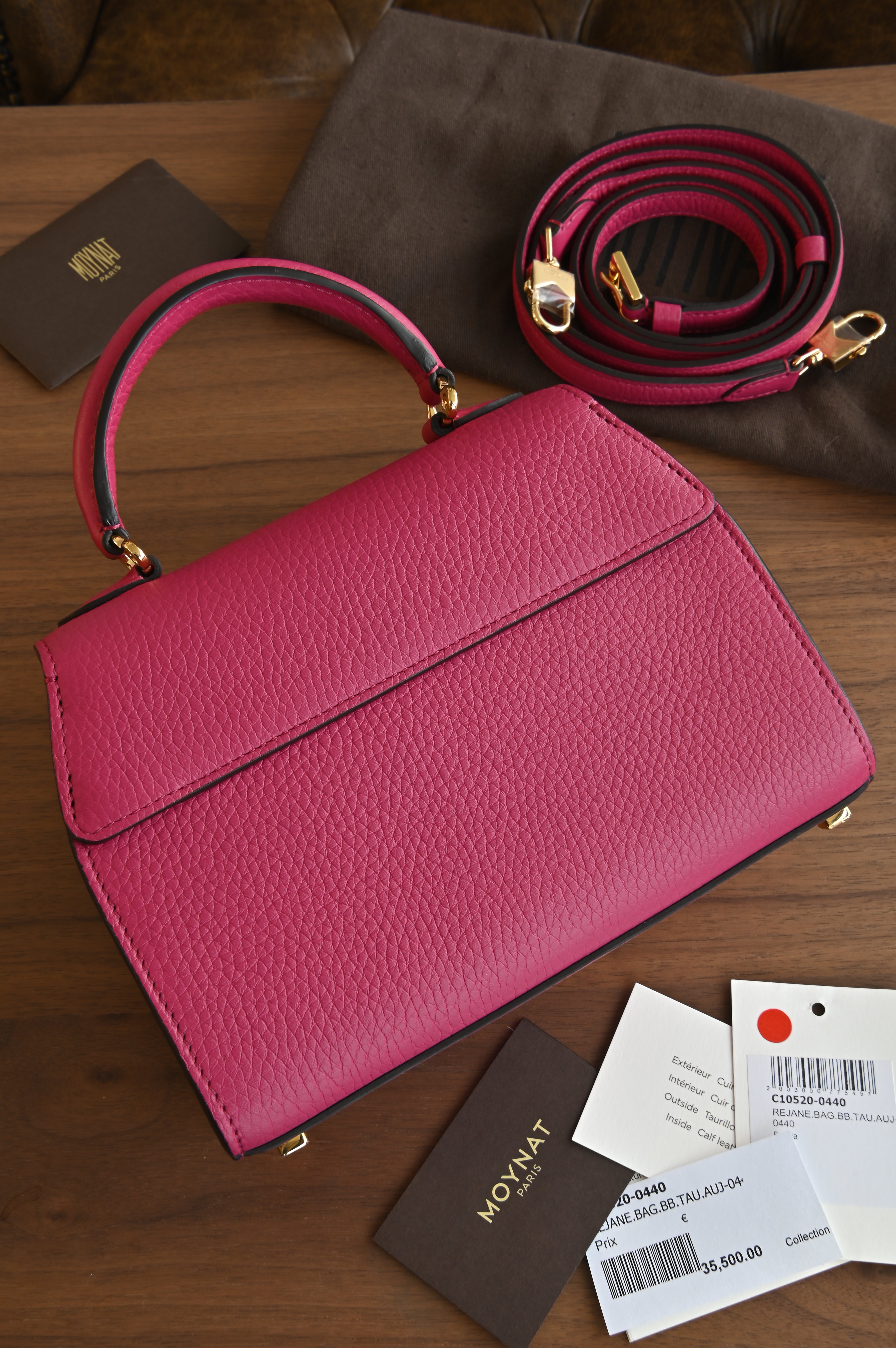 Authentic preloved Moynat Rejane BB in fuchsia pink Taurillon leather – back view