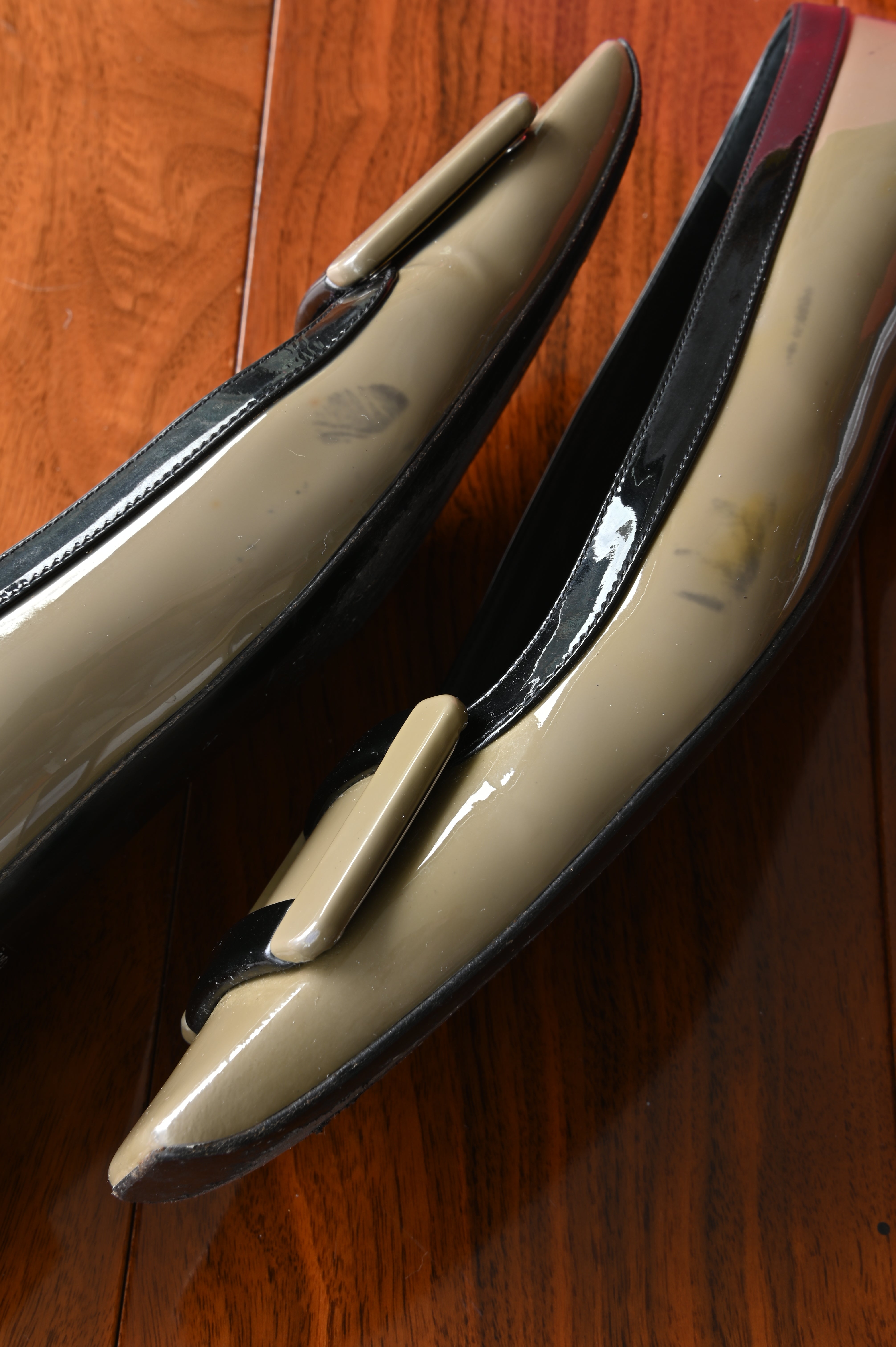 Close-up of the patent leather upper showing the overall condition of the Roger Vivier Belle Vivier pumps, including visible colour transfer from use.