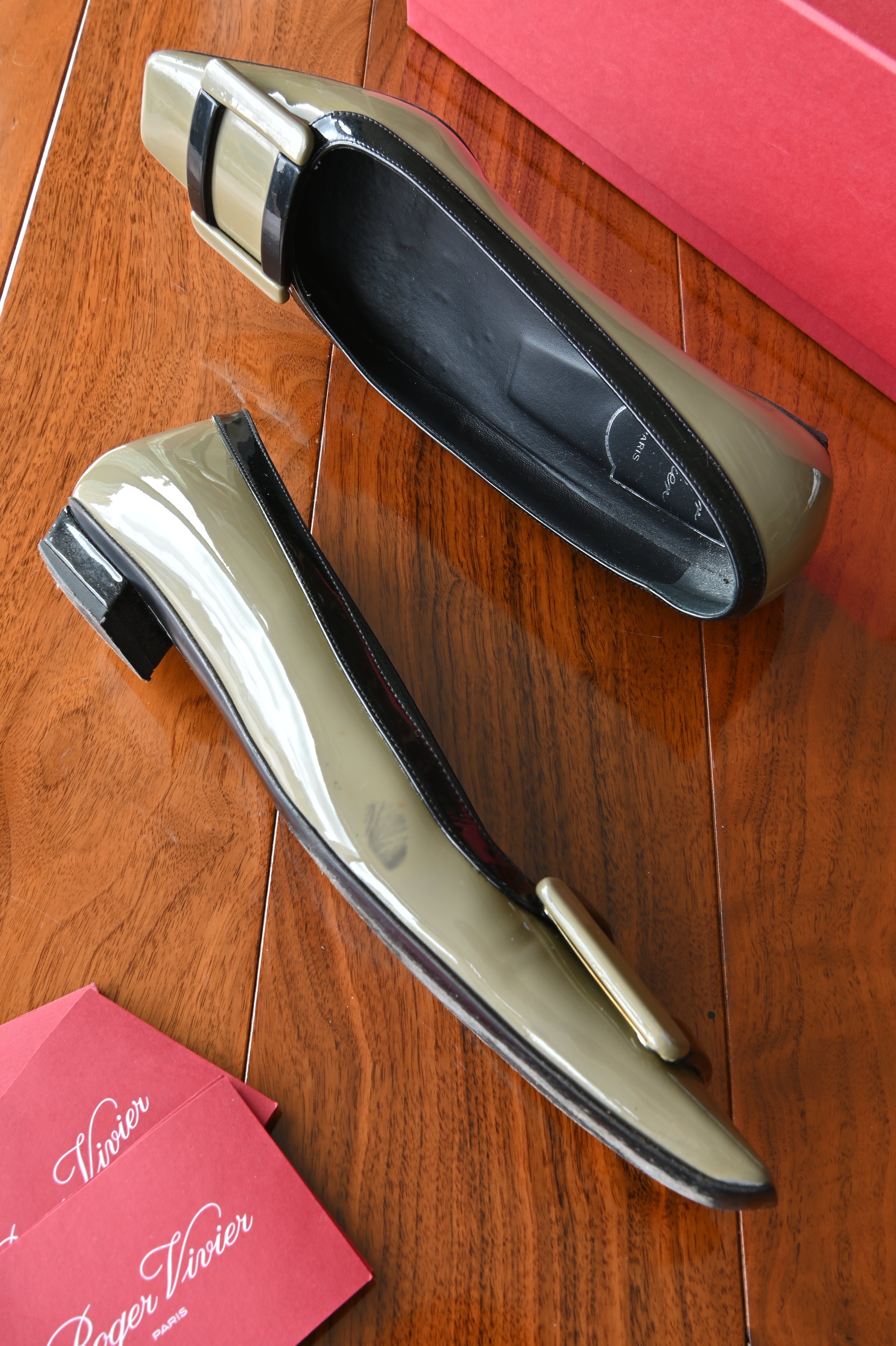 Top angled view of authentic Roger Vivier Belle Vivier pumps showcasing the black leather interior and iconic buckle detail.