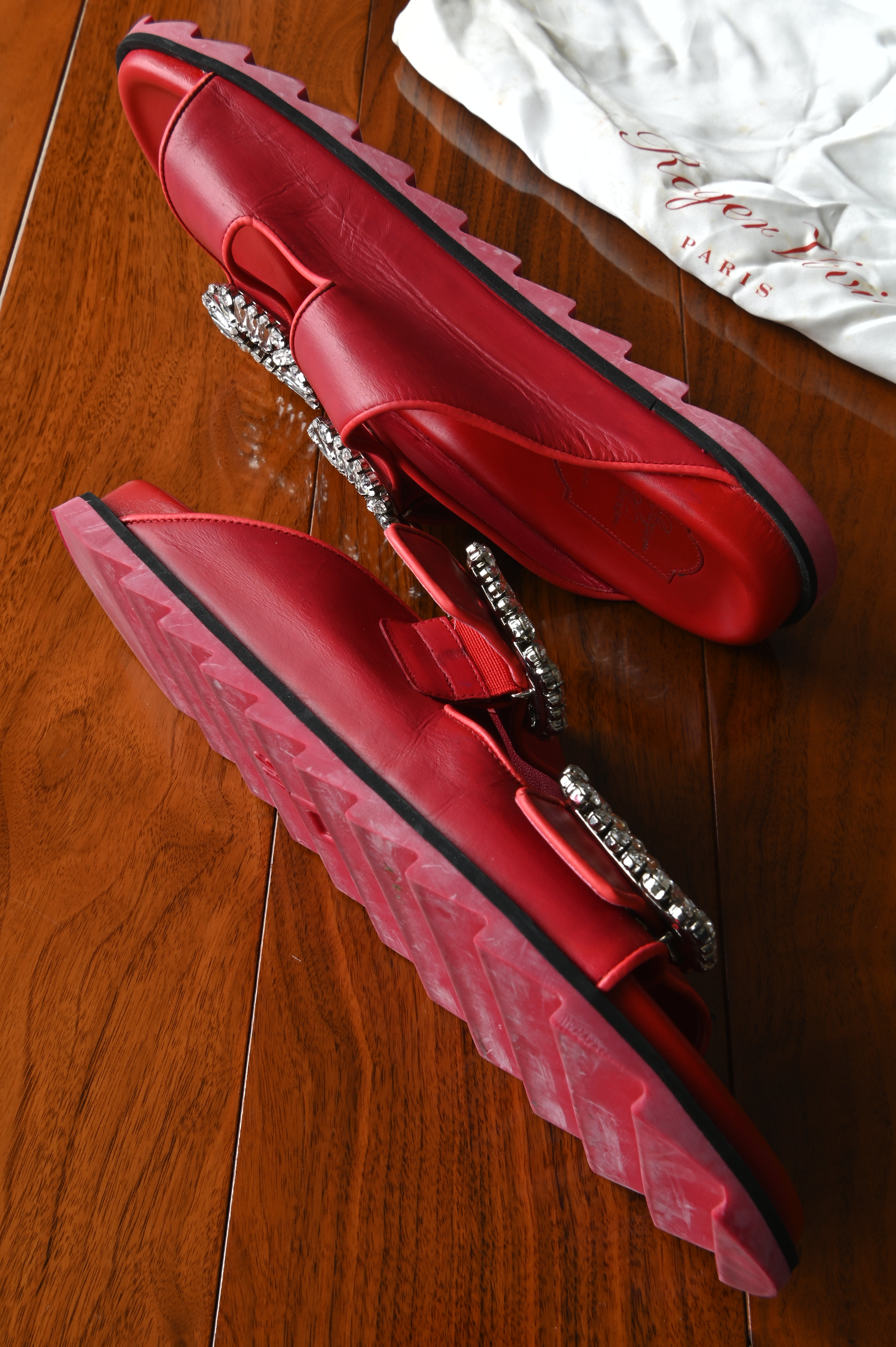 Inner side view of authentic Roger Vivier Viv’ Ranger leather slides showcasing the smooth leather construction and signature crystal buckles.