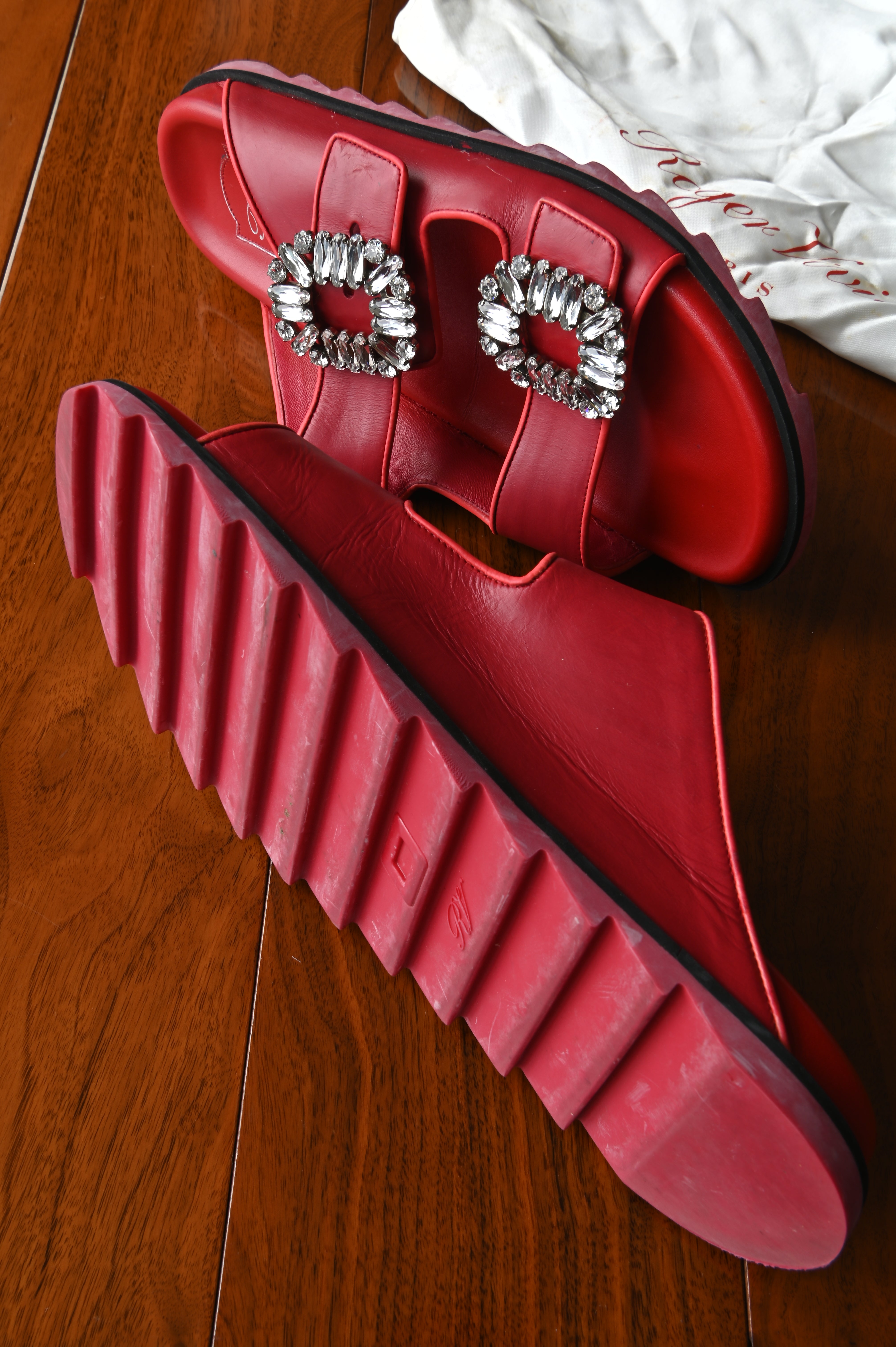 Top view of Roger Vivier Viv’ Ranger slides featuring double leather straps and iconic crystal strass buckles.