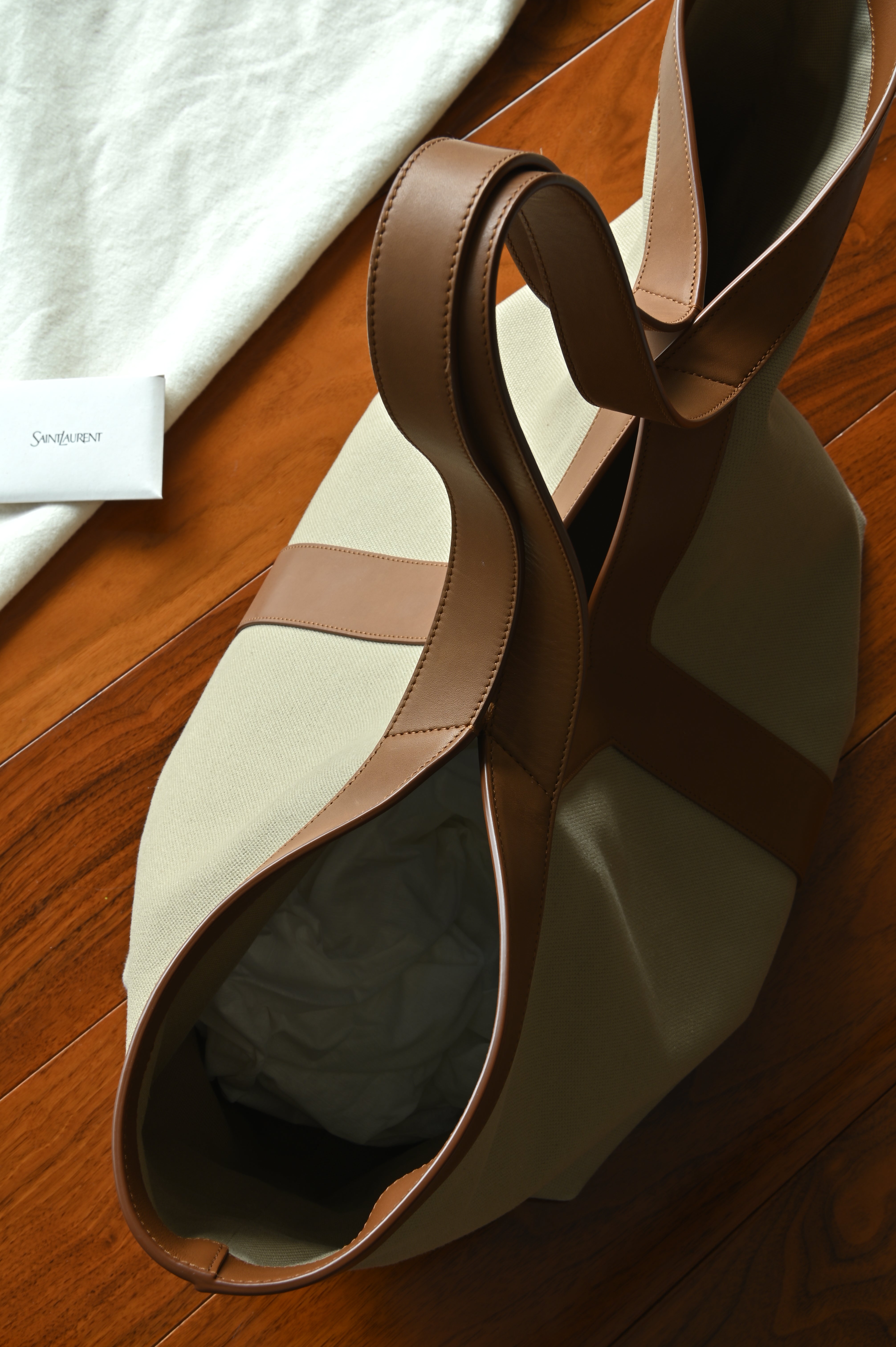 Authentic Saint Laurent Y Canvas Shopping Tote Bag viewed from above, highlighting the open-top design, leather shoulder straps and spacious interior.
