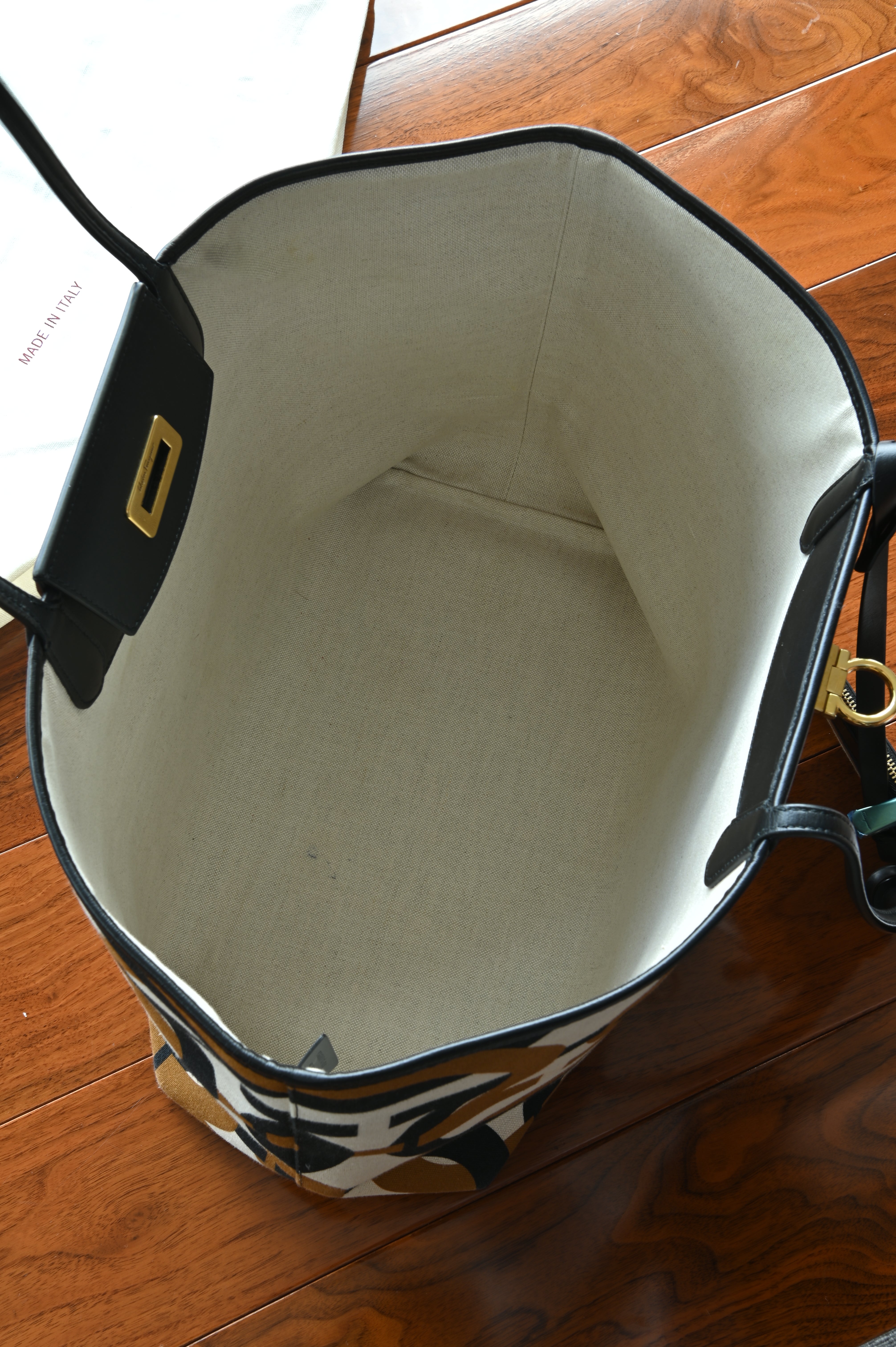Authentic Salvatore Ferragamo Monogram Canvas Tote Bag featuring a clean, spacious fabric-lined interior in like new condition.