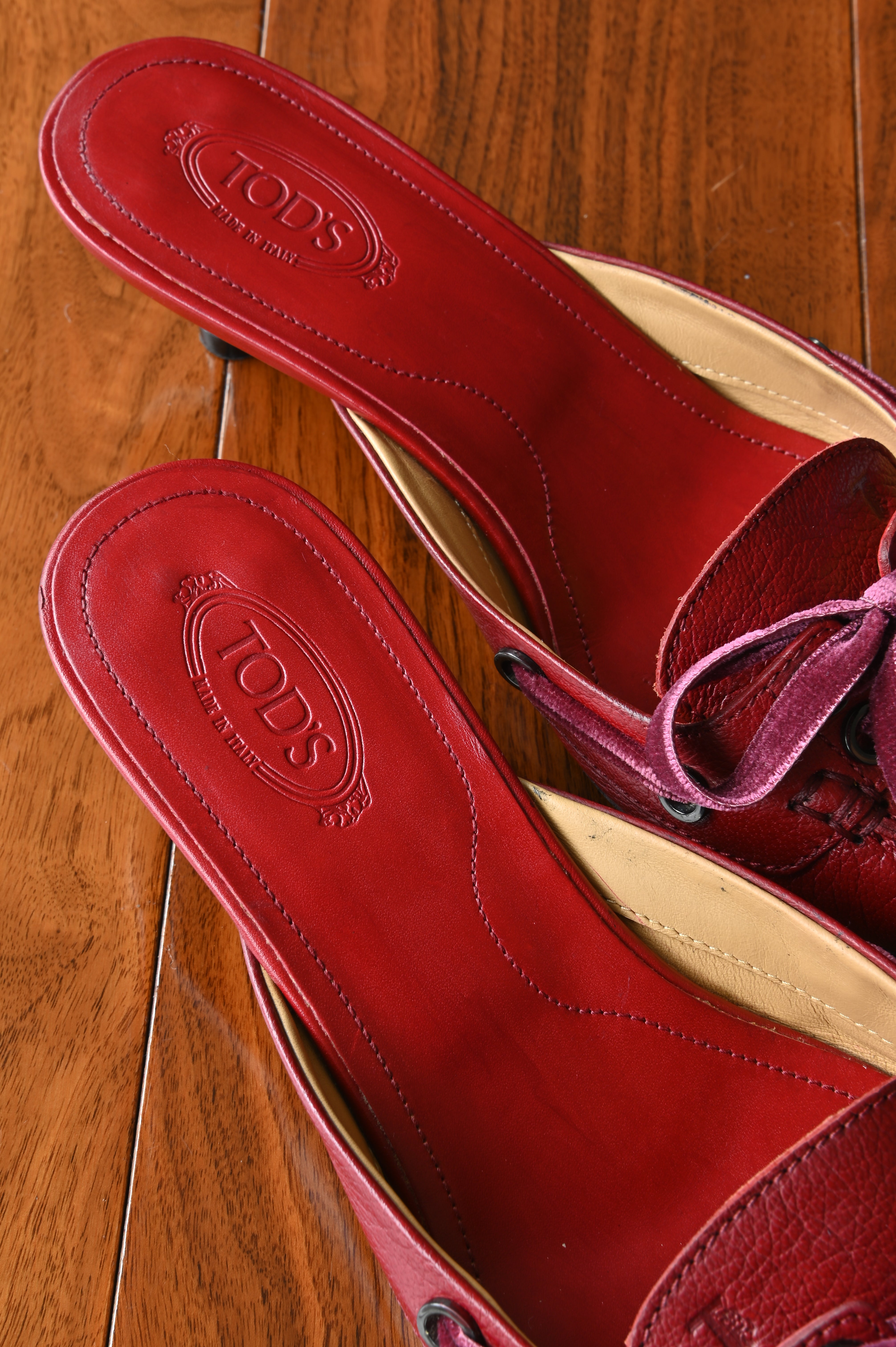 Close-up of the Tod’s Made in Italy branding and clean leather interior showcasing the craftsmanship and condition.