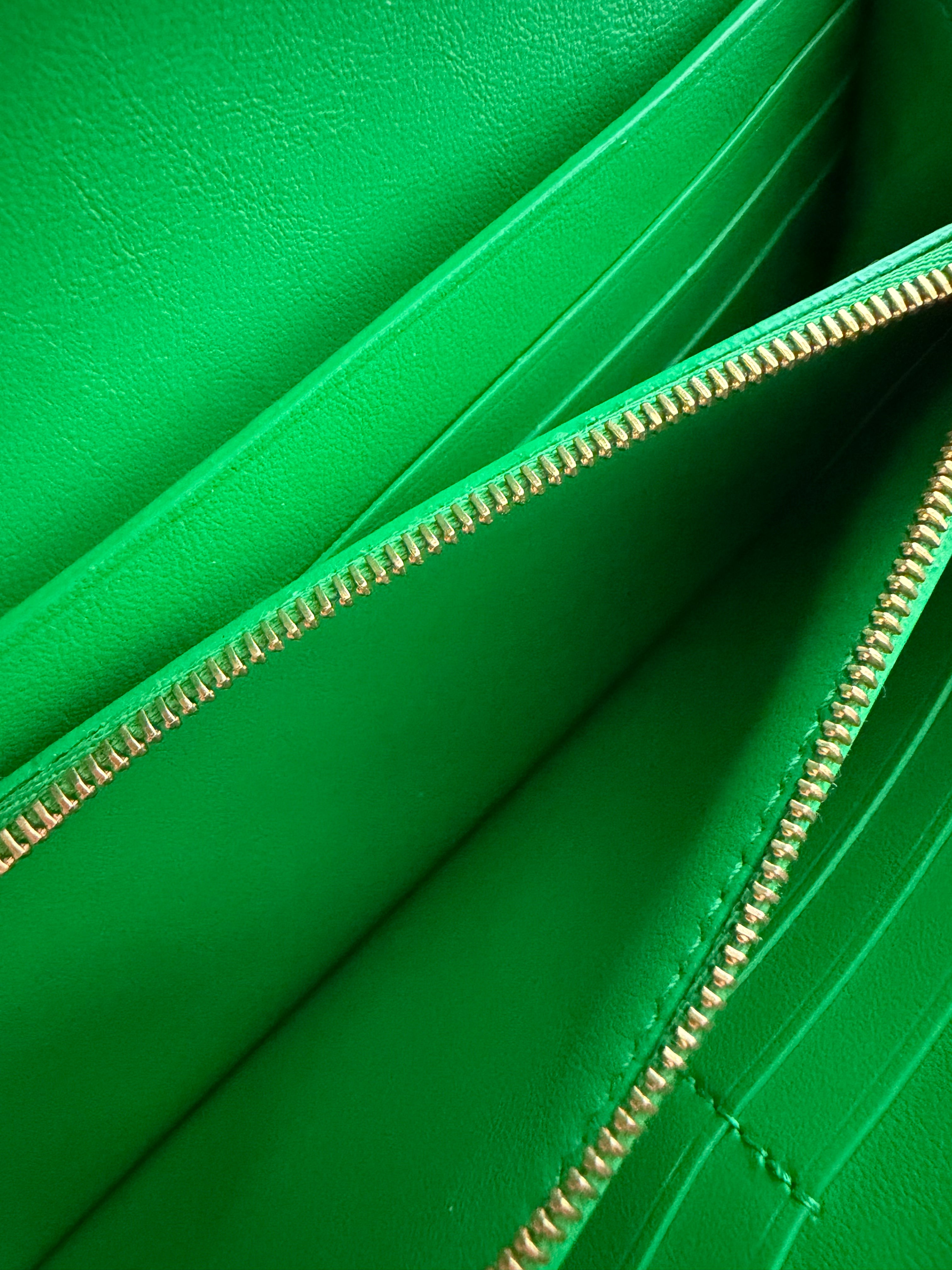 Bottega Veneta long envelope wallet in black and parakeet green zipper