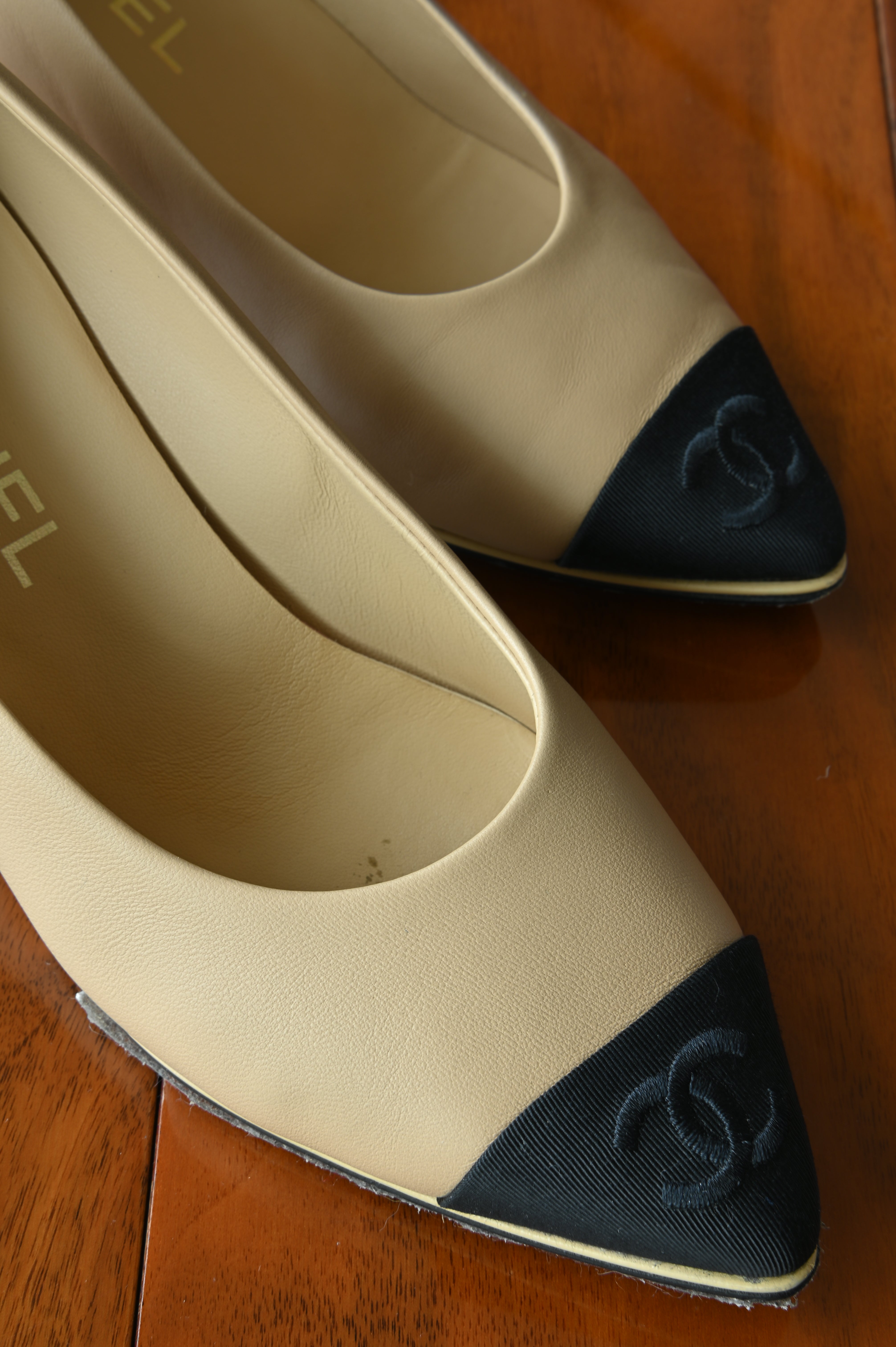 Chanel Beige Black Block Heel Pumps front