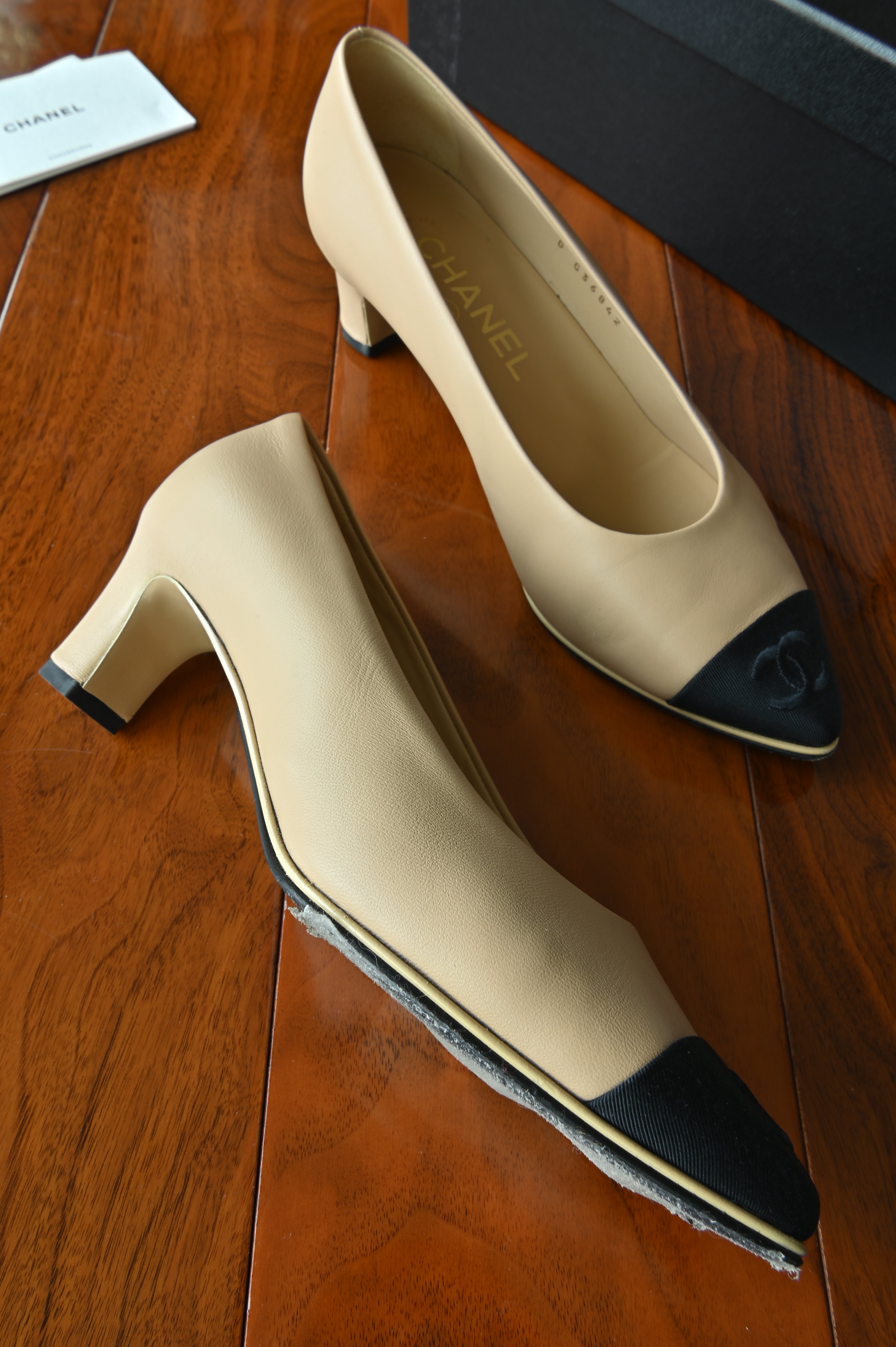 Chanel Beige Black Block Heel Pumps left