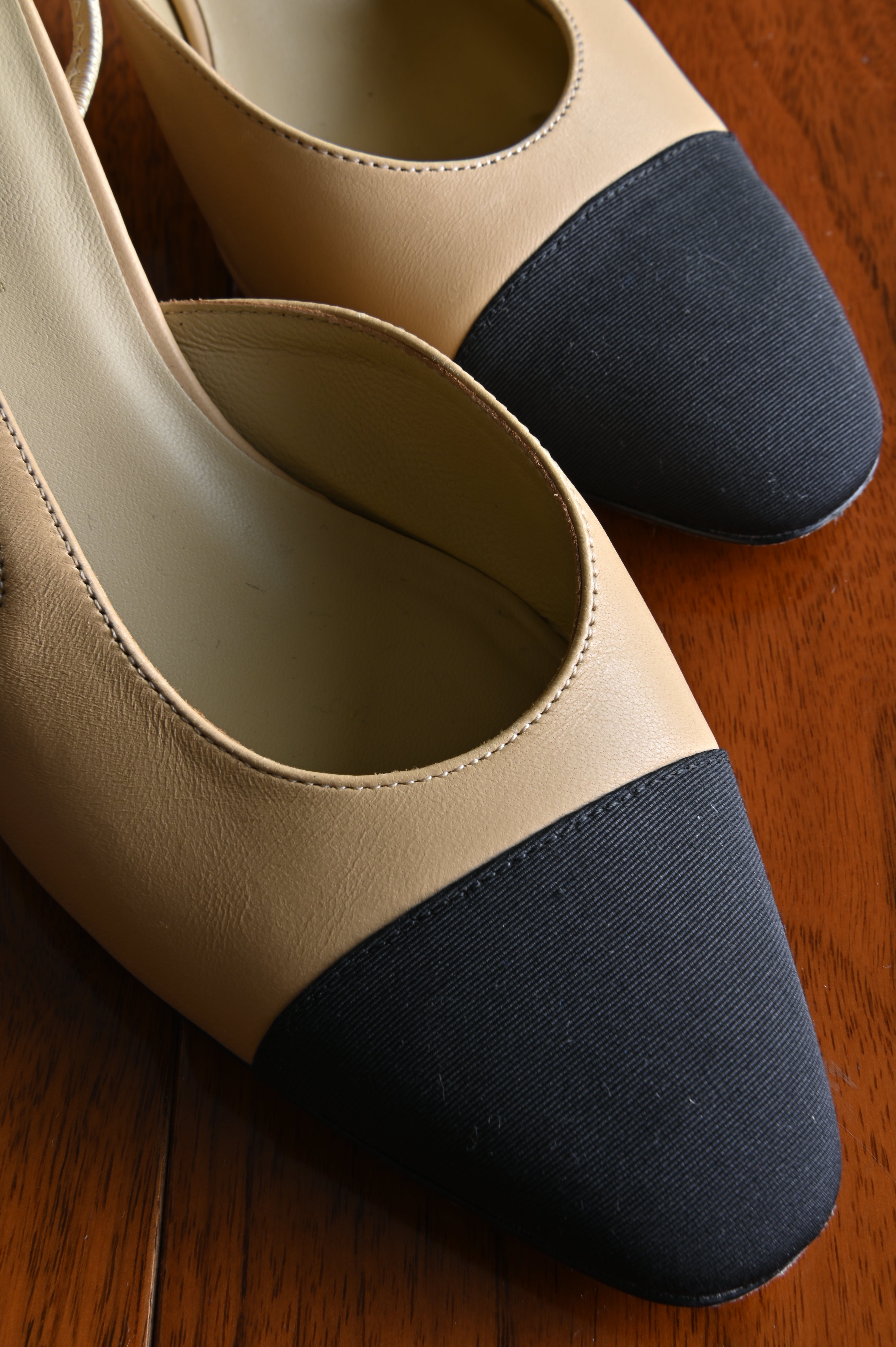 Chanel Beige Black Slingback Heels front