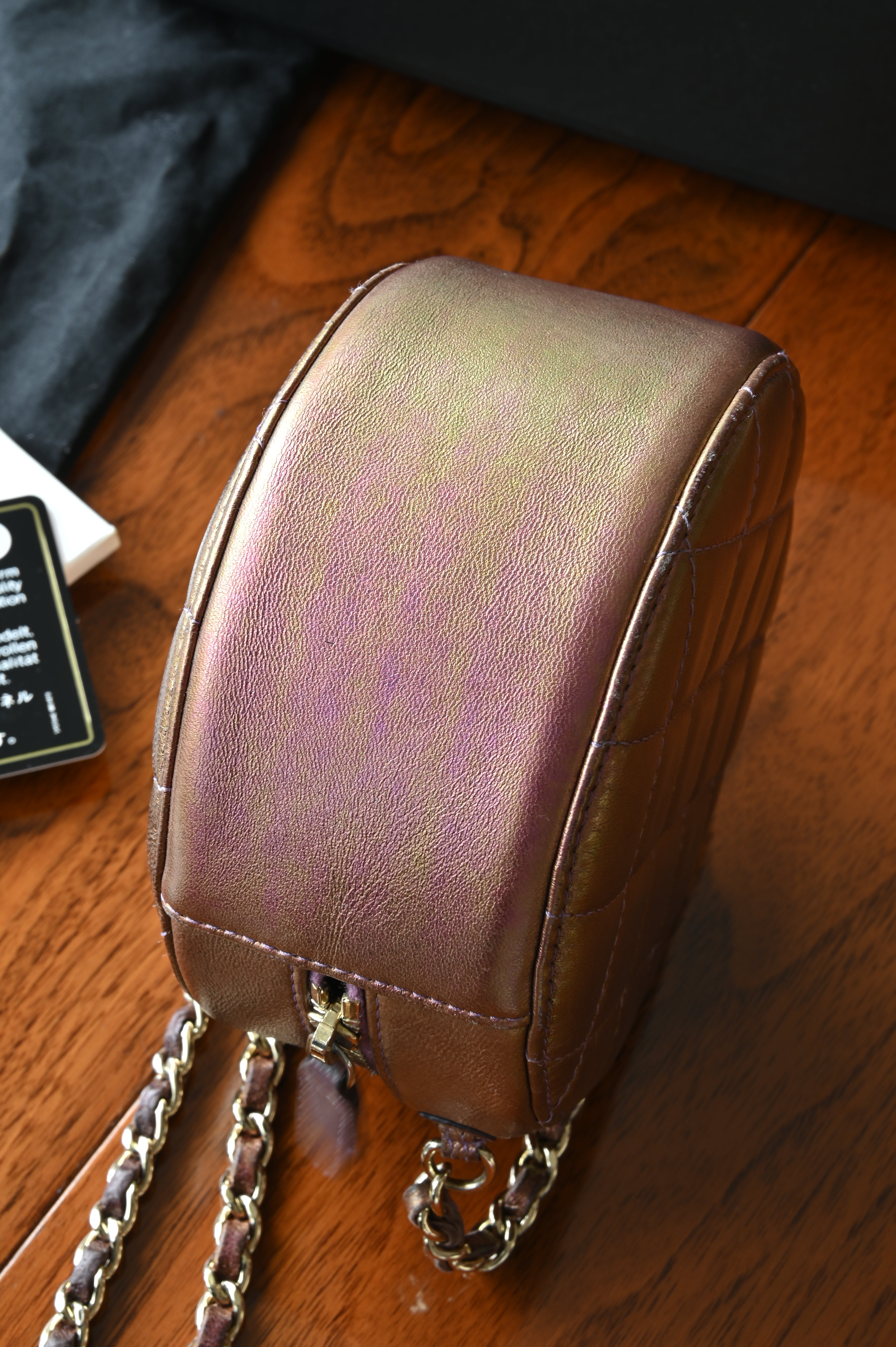 Chanel Purple Quilted Iridescent Round Sling Bag bottom